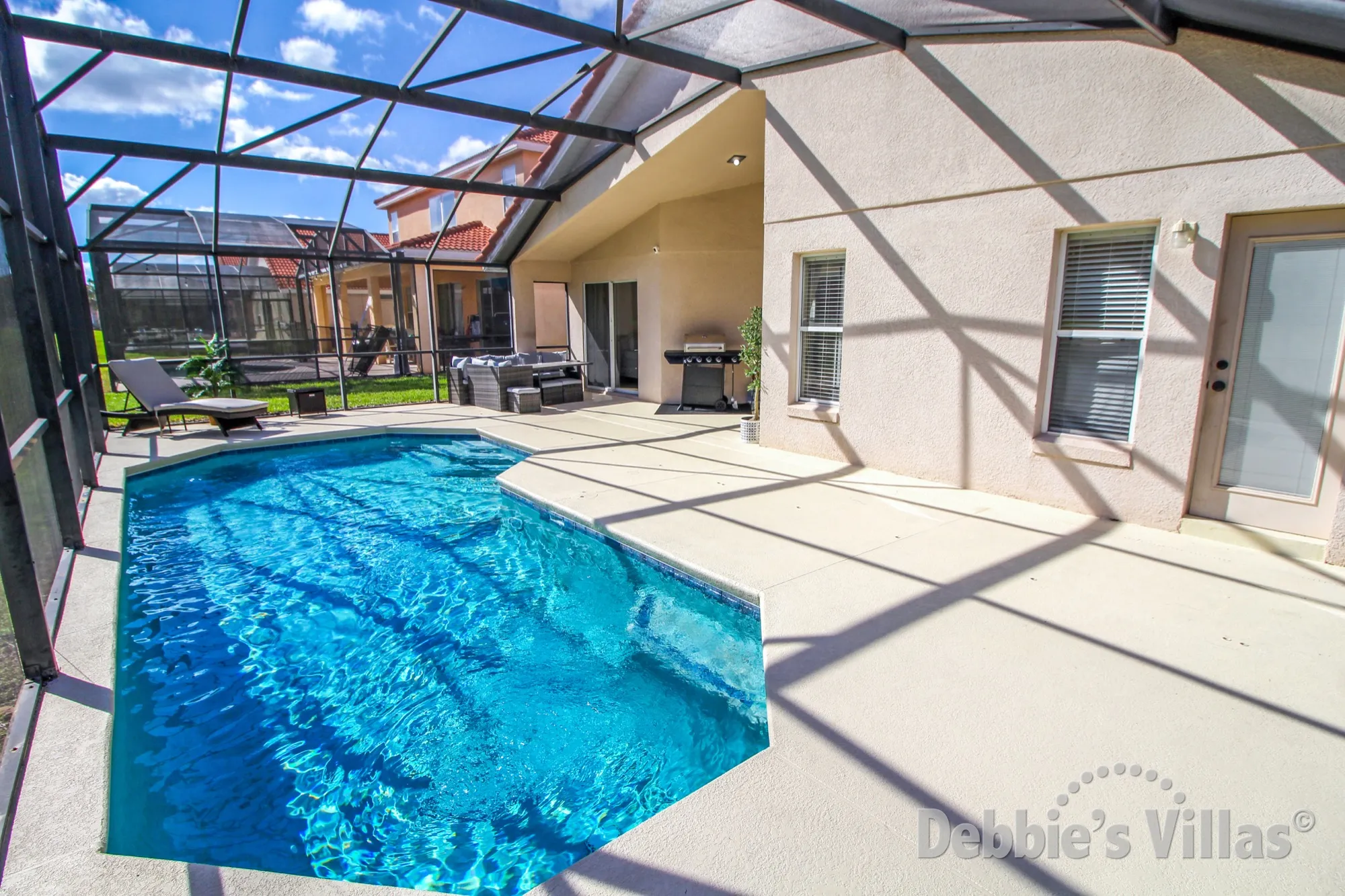 Plenty of space on the sun-drenched pool deck of this Davenport vacation villa