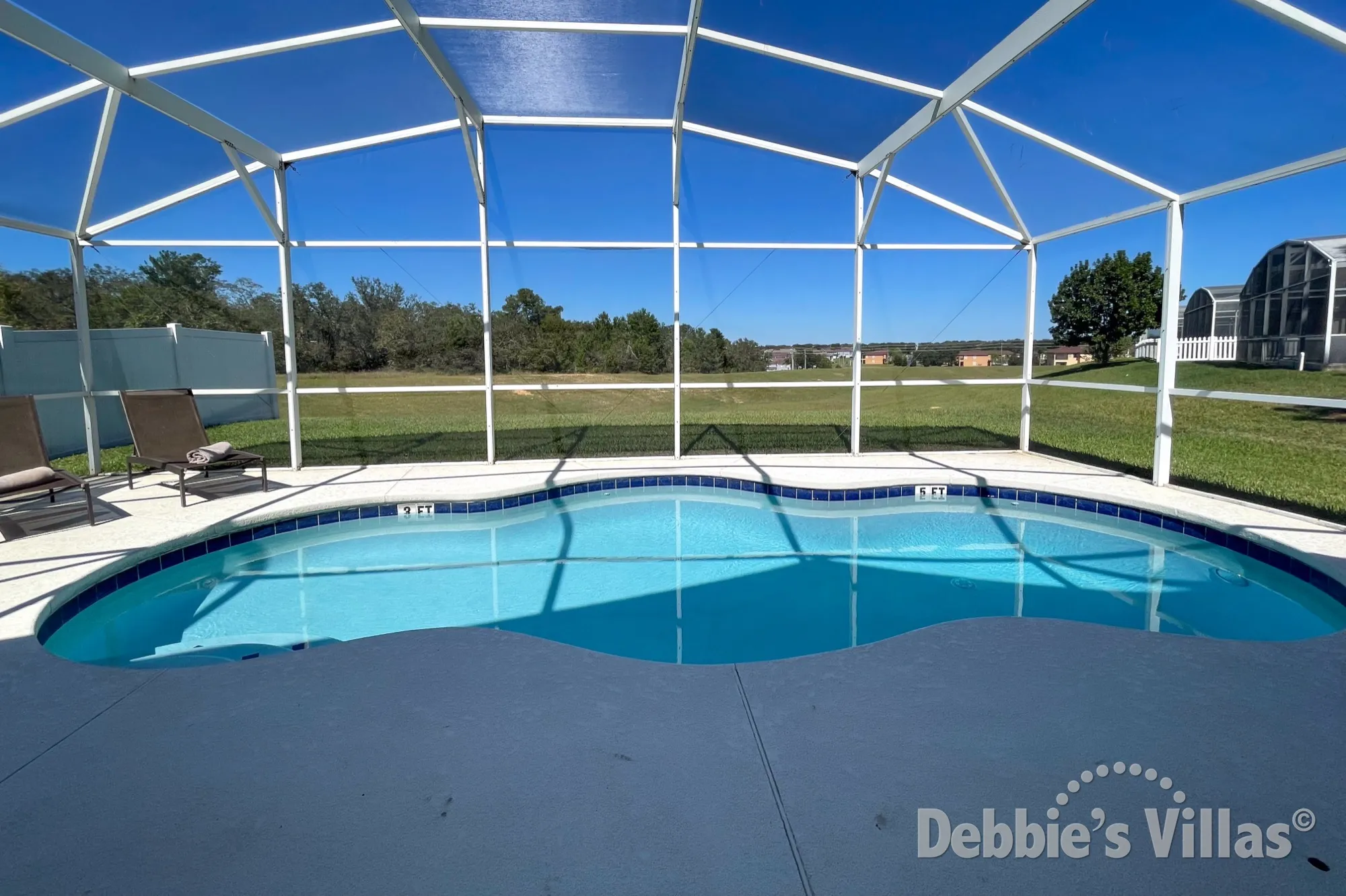Scenic view from the sun-drenched pool and spa deck at this Highlands Reserve vacation villa