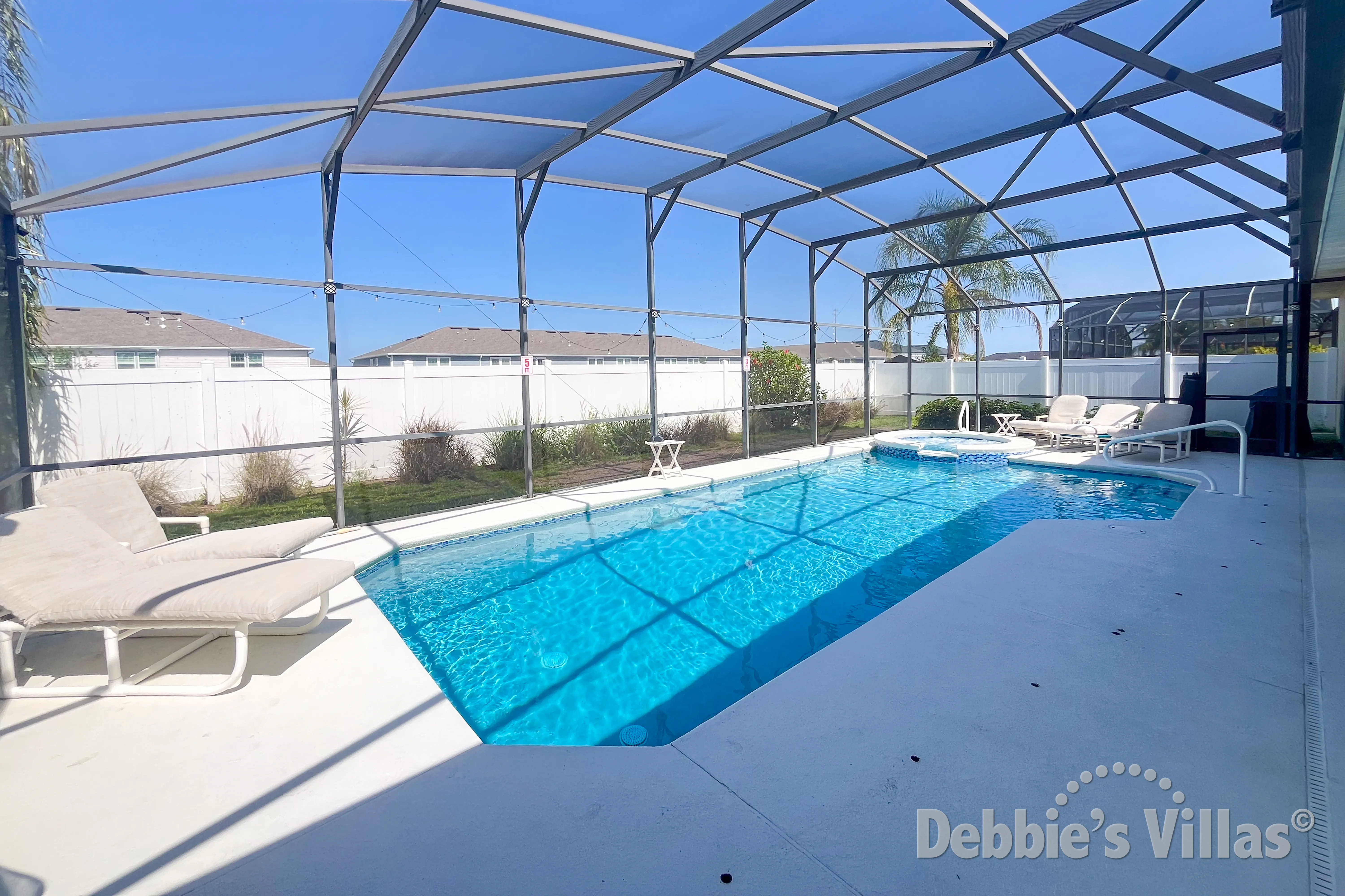 West-facing pool and spa at this vacation villa on The Manor at West Haven in Davenport 