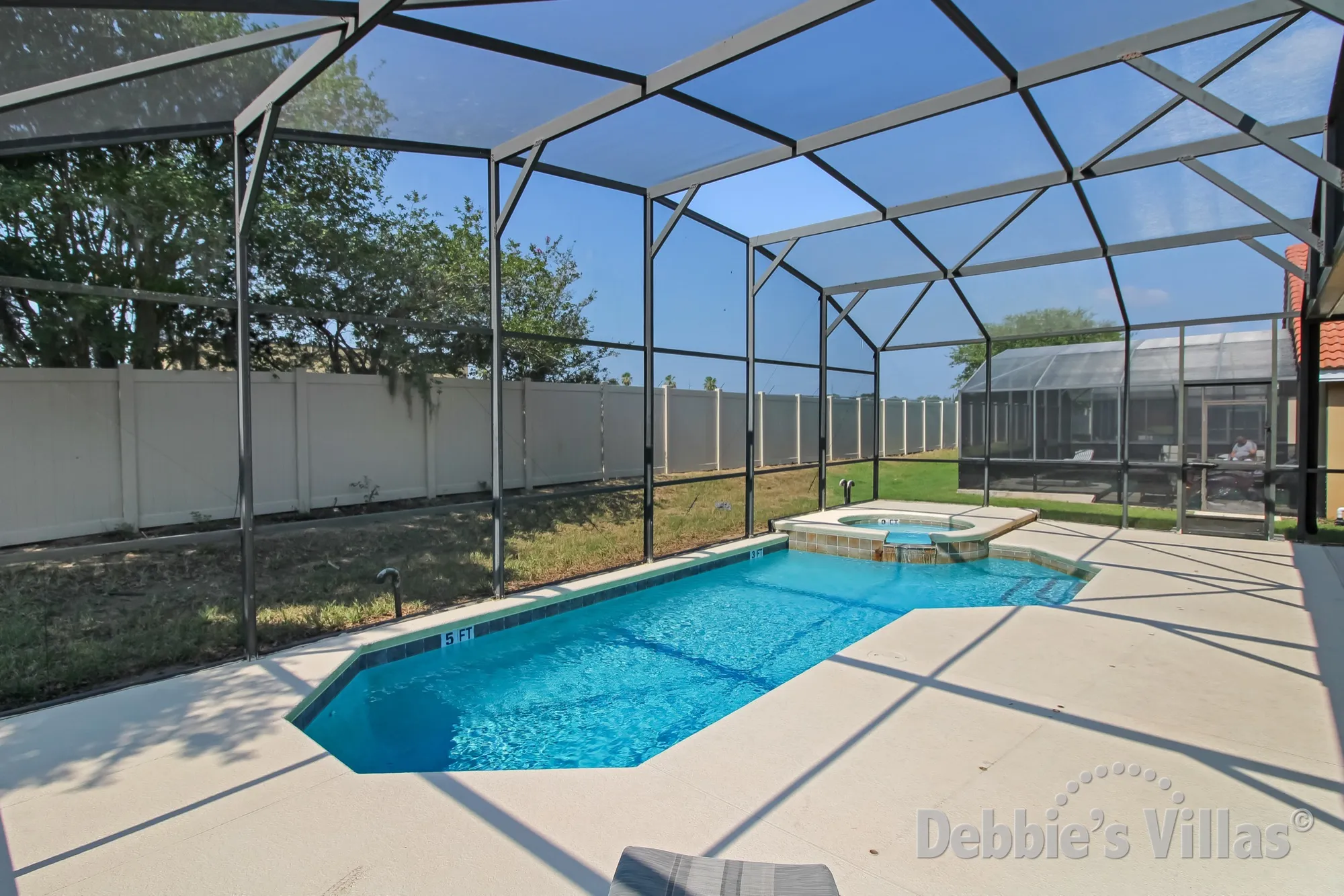 South-facing private pool and spa at this vacation villa in Davenport