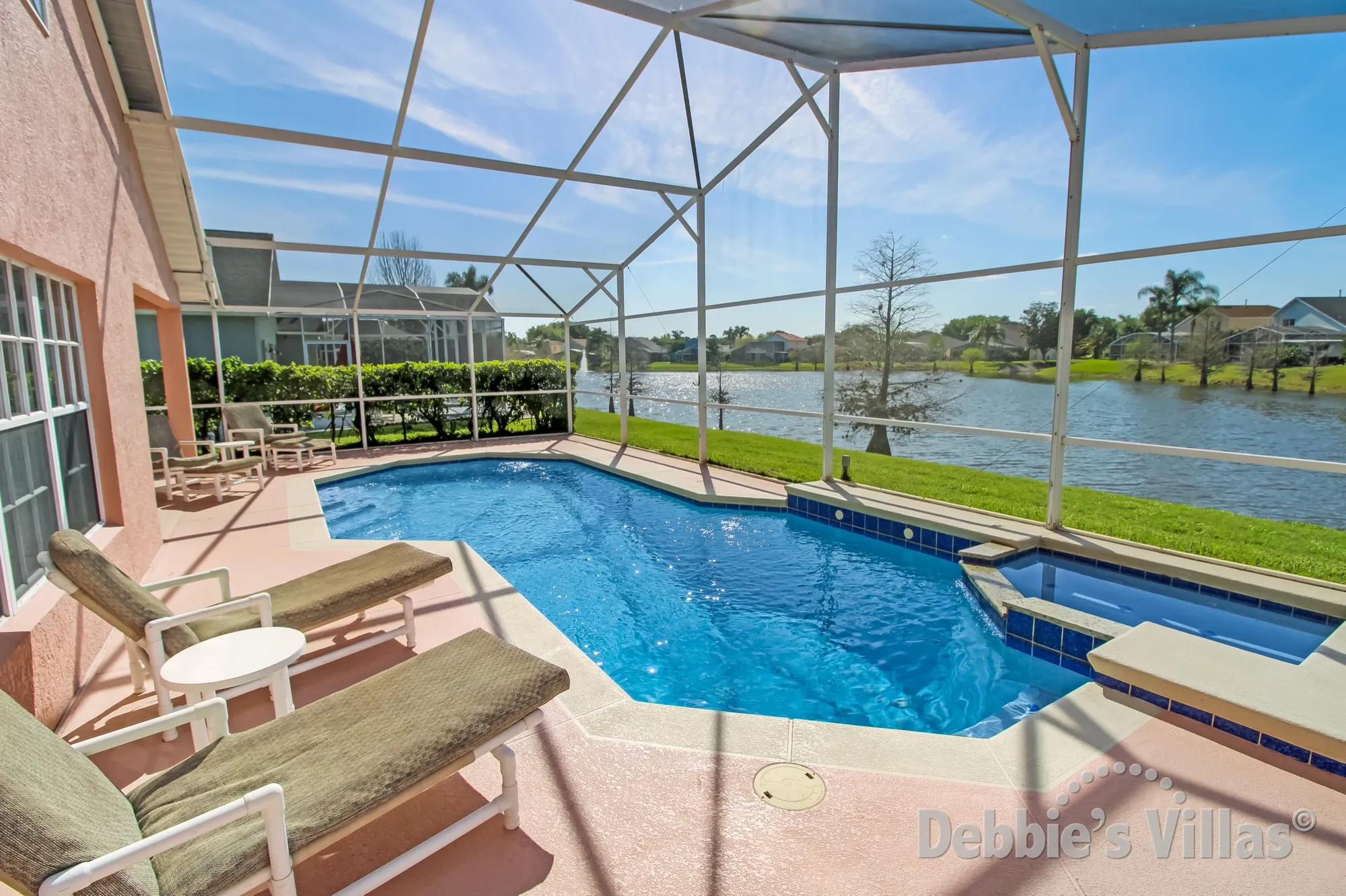 Kissimmee villa with a lake view from the south-facing private pool and spa
