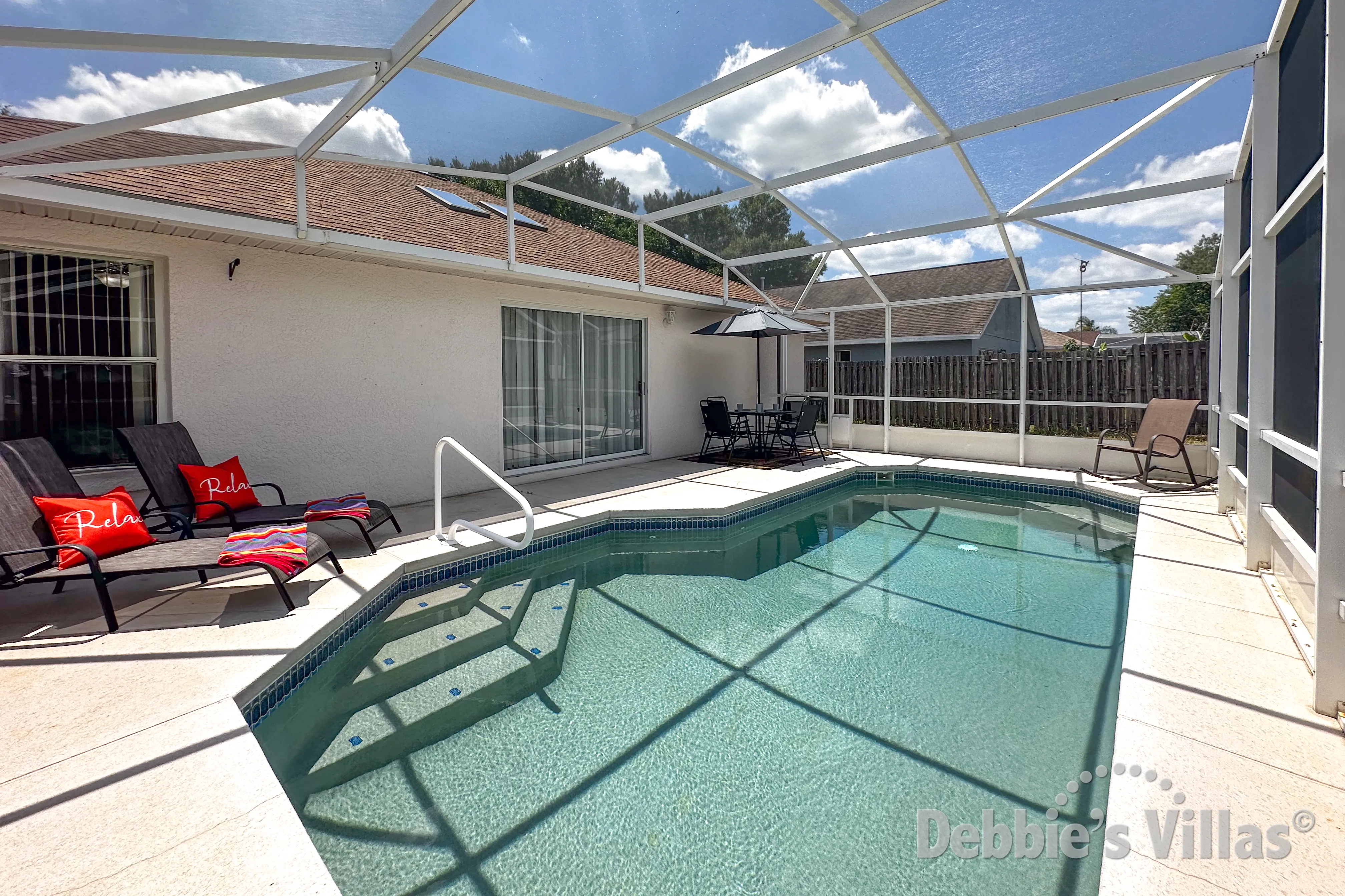 Sun-drenched pool deck at this Davenport vacation villa