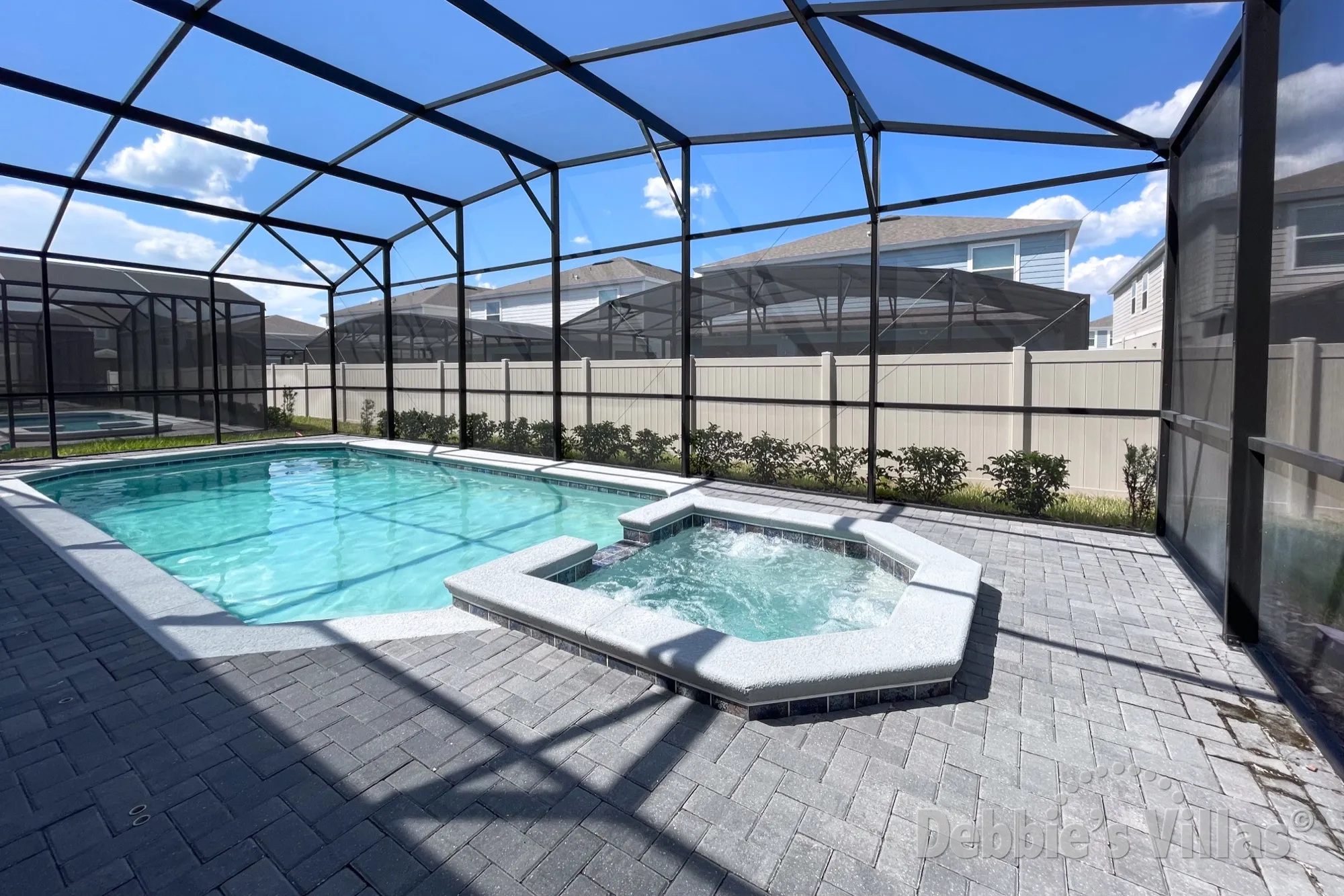 Sun-drenched pool and spa deck at this Windsor Island vacation villa