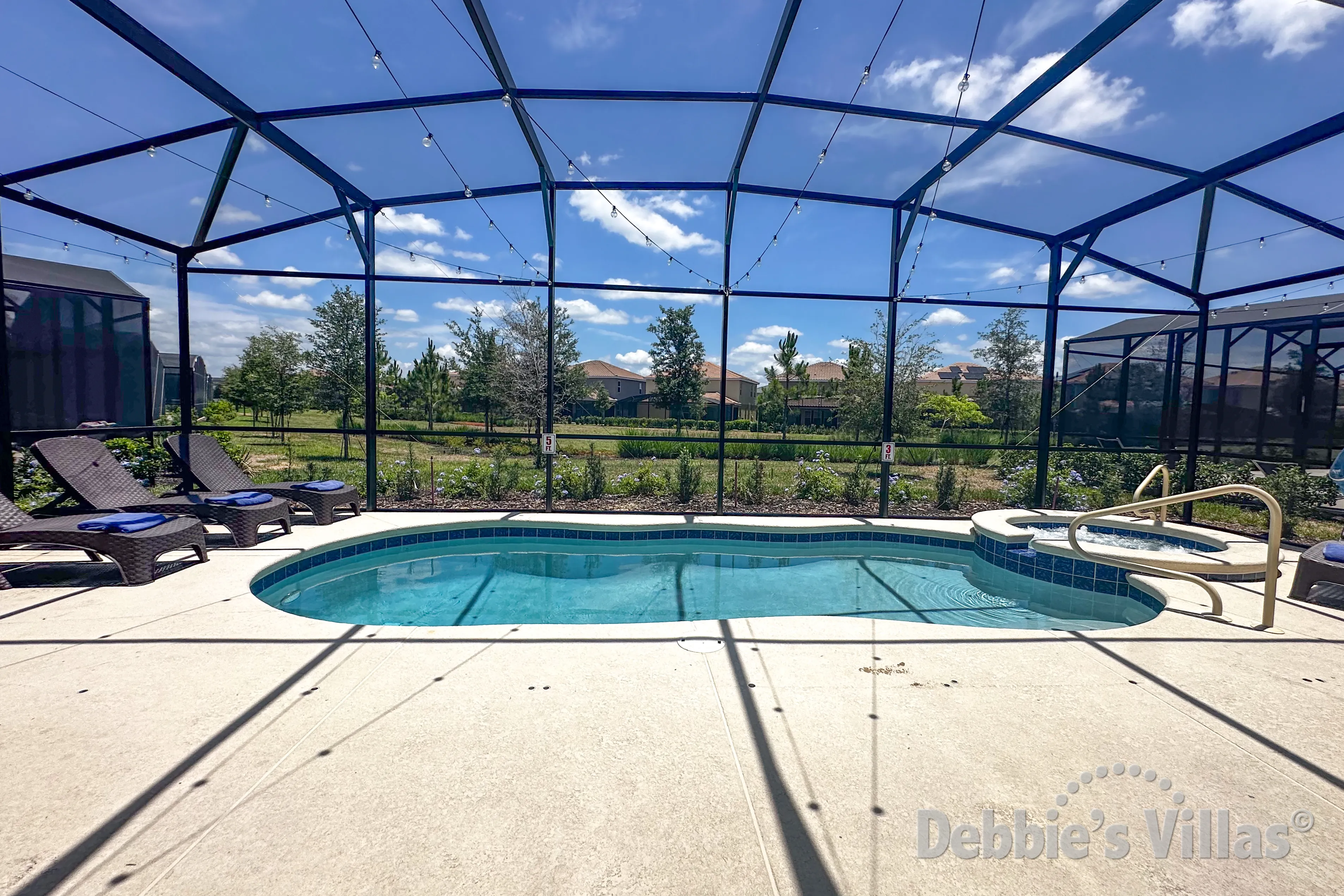 Southeast-facing pool and spa at this vacation villa on Solterra in Davenport