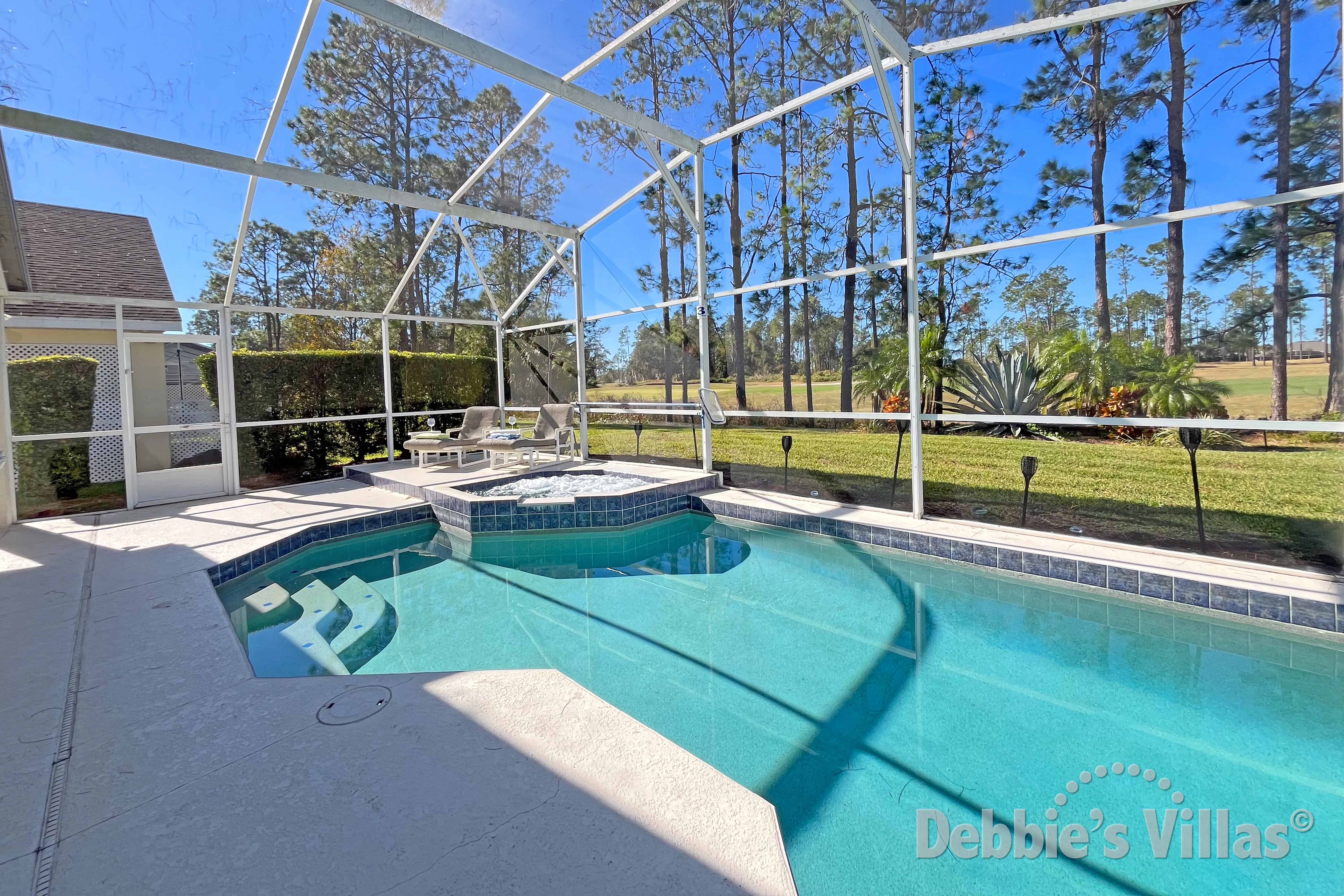 Scenic golf course views from the west-facing pool at this Davenport vacation villa
