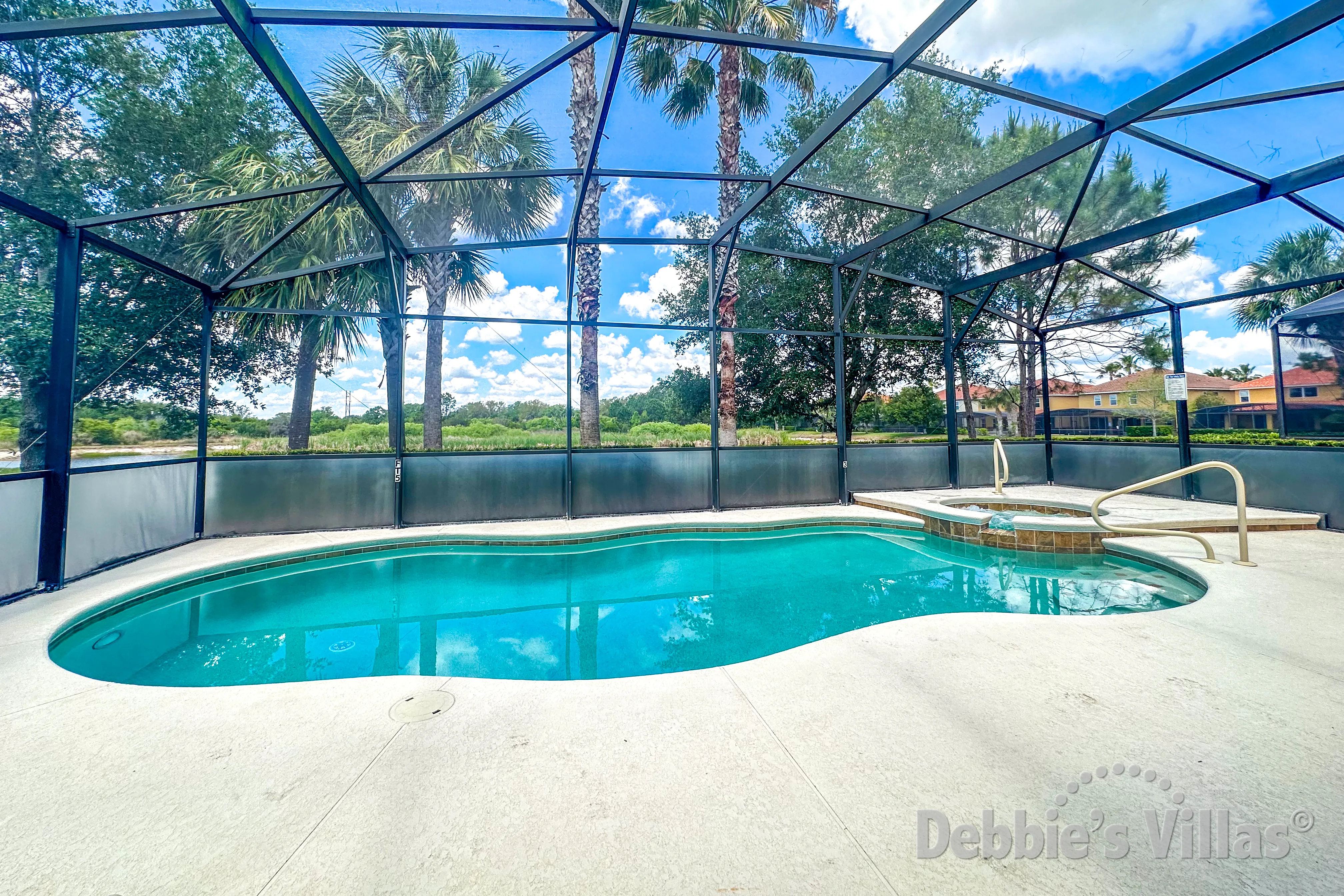 West-facing pool and spa at this vacation villa on Solterra in Davenport 