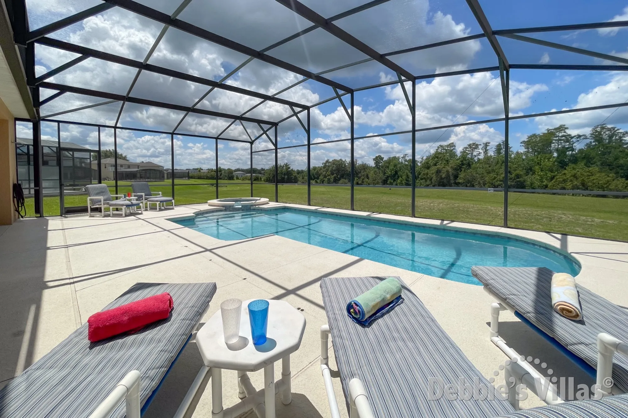 Soak up the sun on the serene southwest-facing pool deck of this Davenport vacation villa