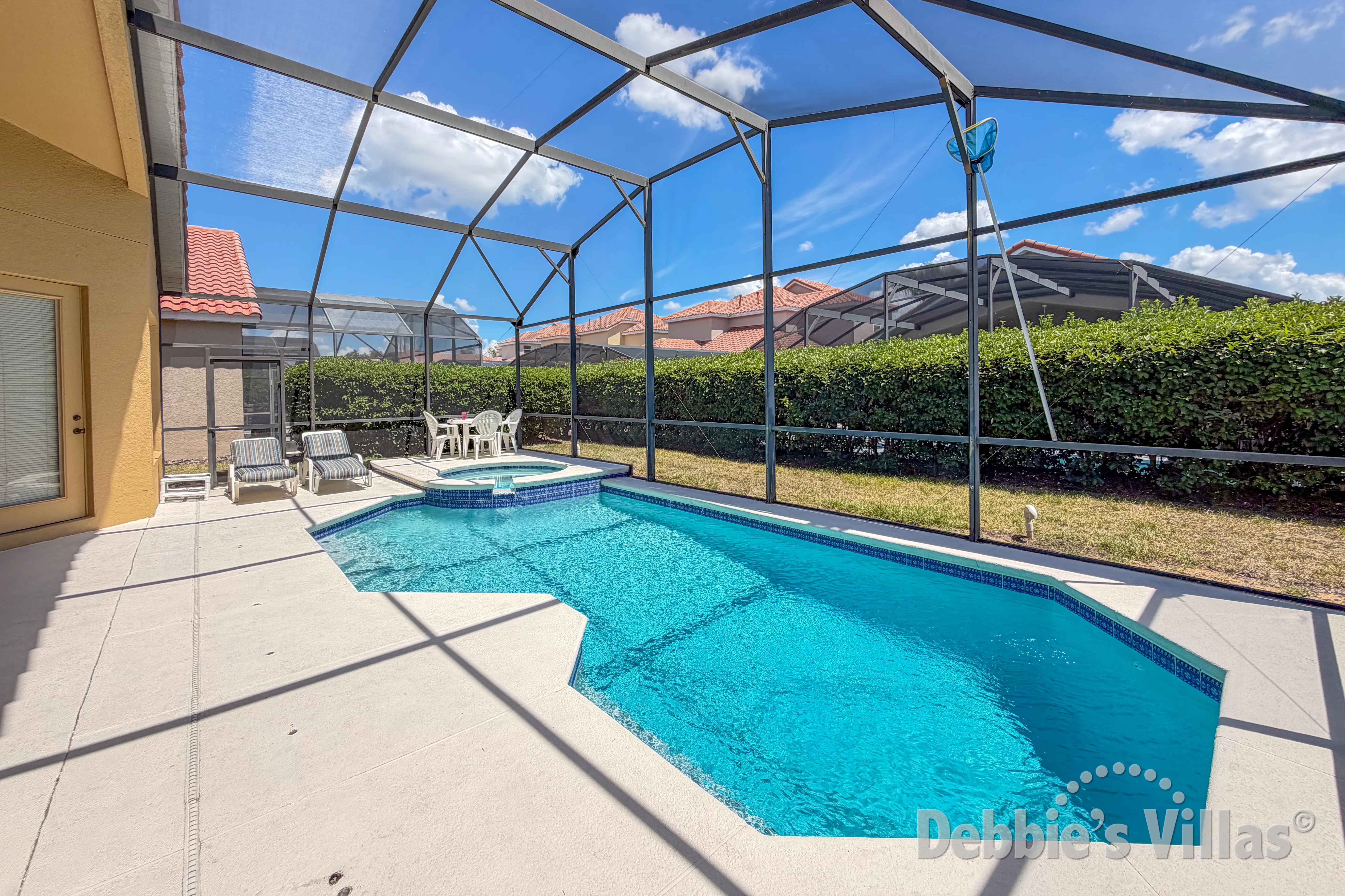 South-facing pool and spa at this vacation villa on Tuscan Hills in Davenport