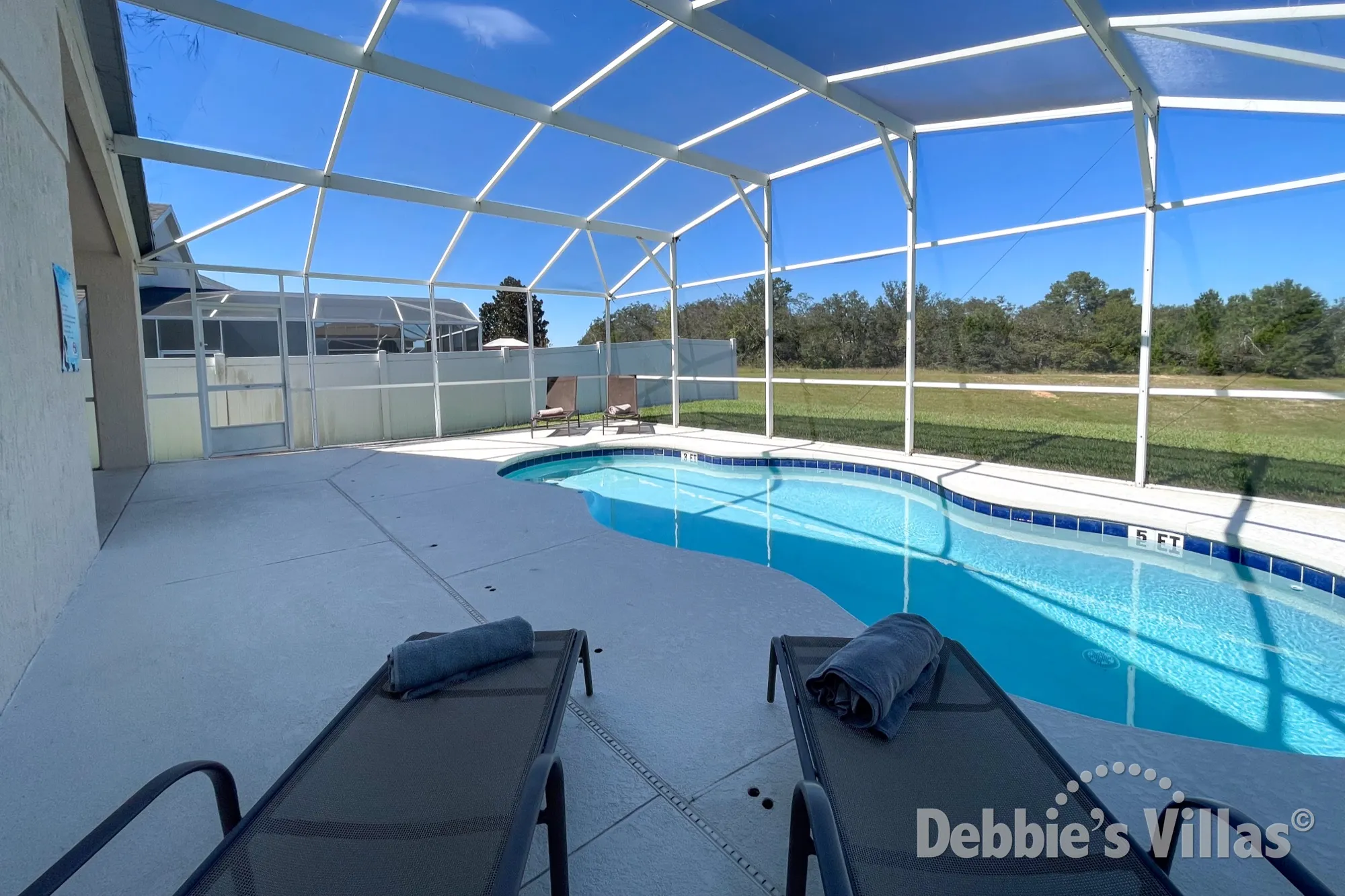 Top up your tan on the pool deck of this Highlands Reserve vacation villa