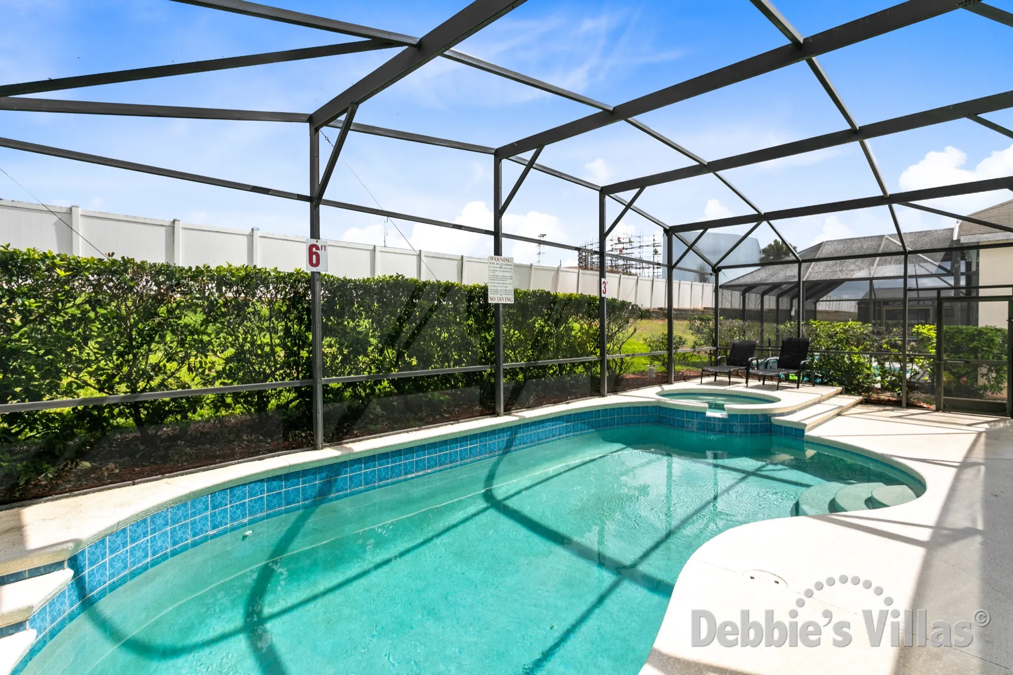 Sunny secluded pool and spa deck at this Windsor Palms vacation villa