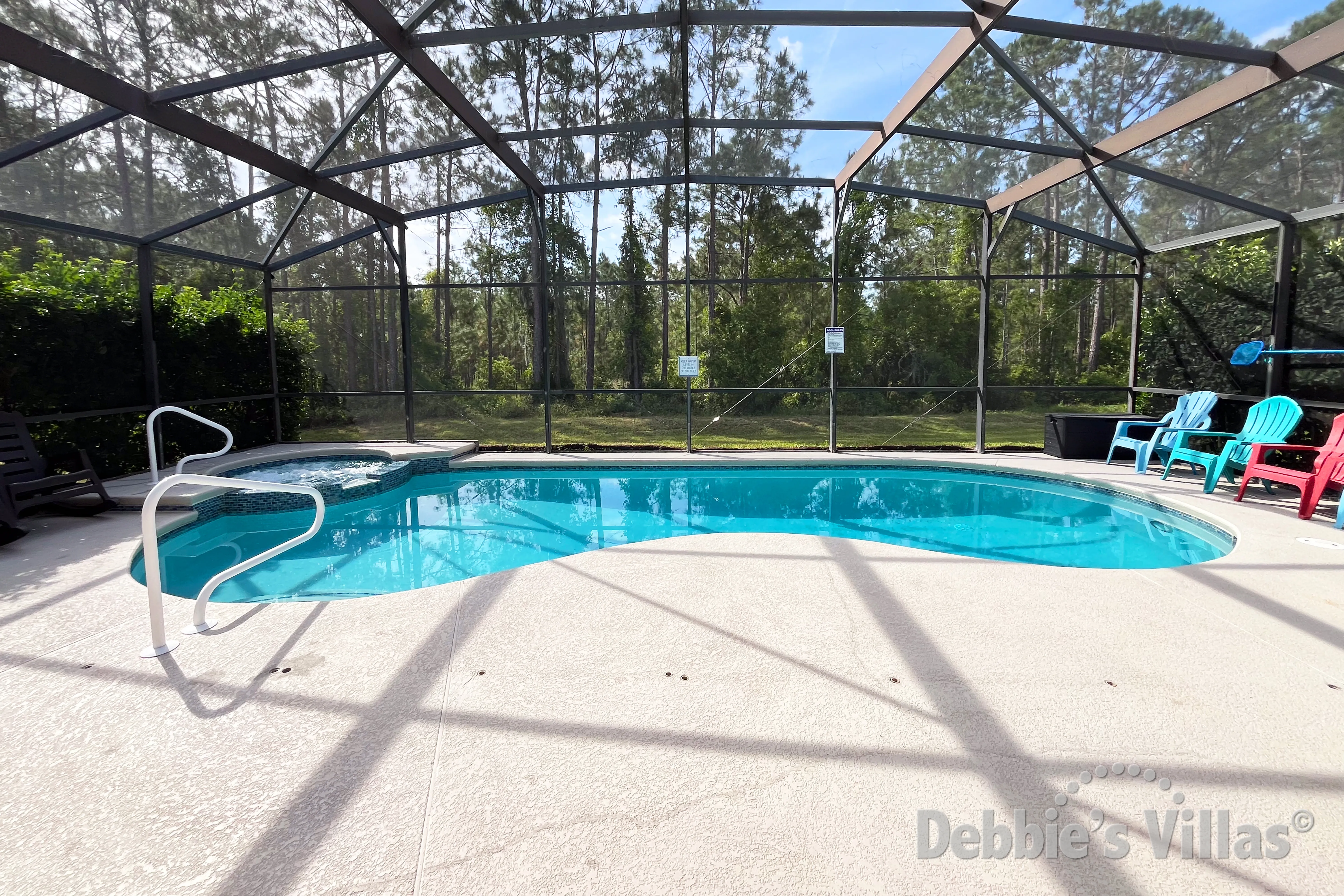 South-facing pool and spa at this vacation villa on Watersong in Davenport