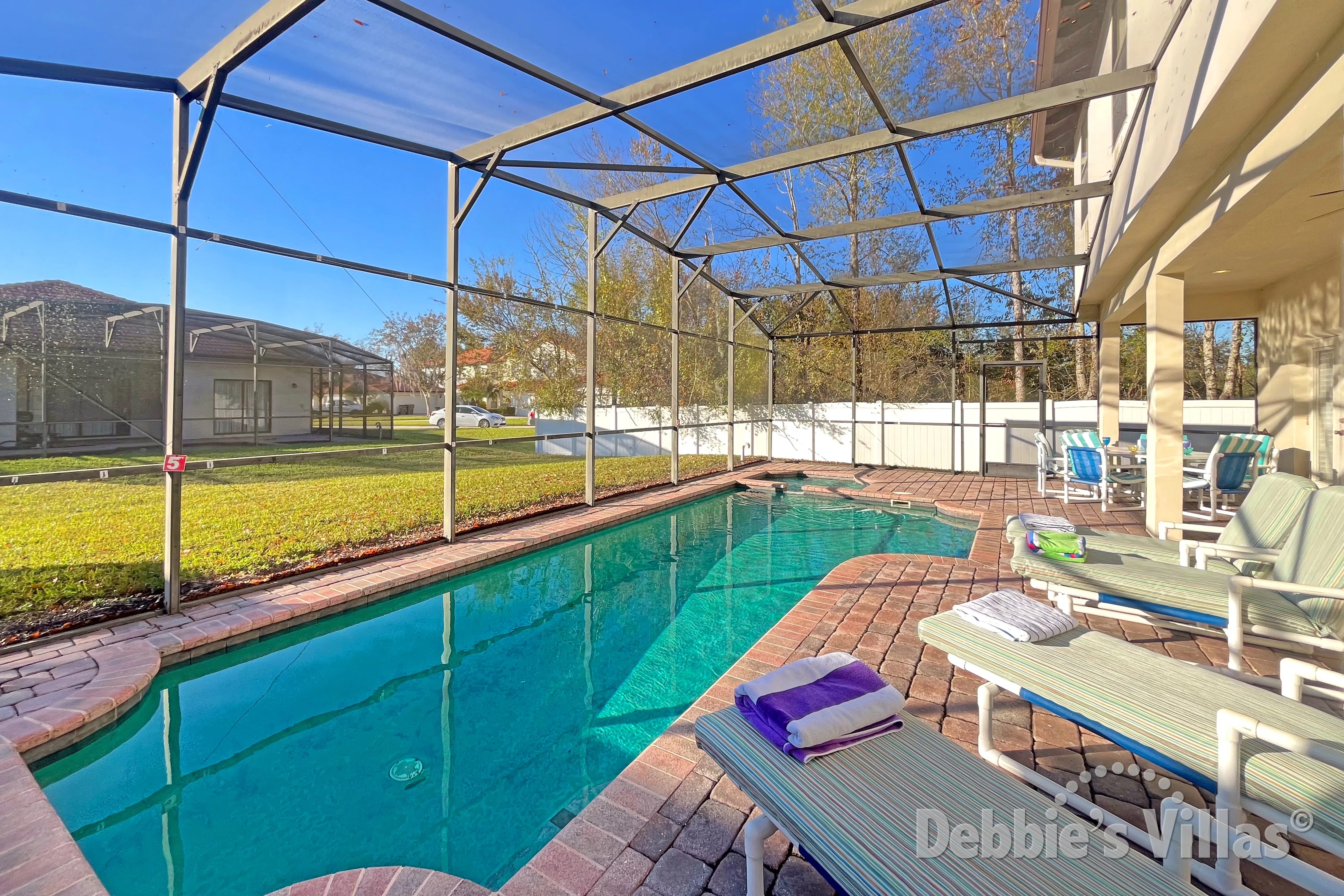 West-facing pool and spa at this vacation villa on High Grove in Clermont