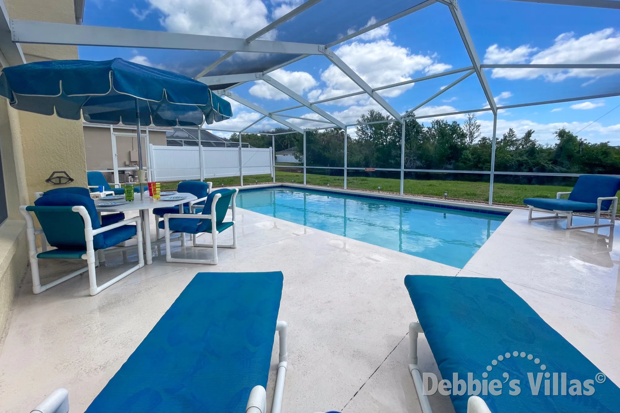 Enjoy snacks and drinks on the pool deck of this Bridgewater Crossing villa