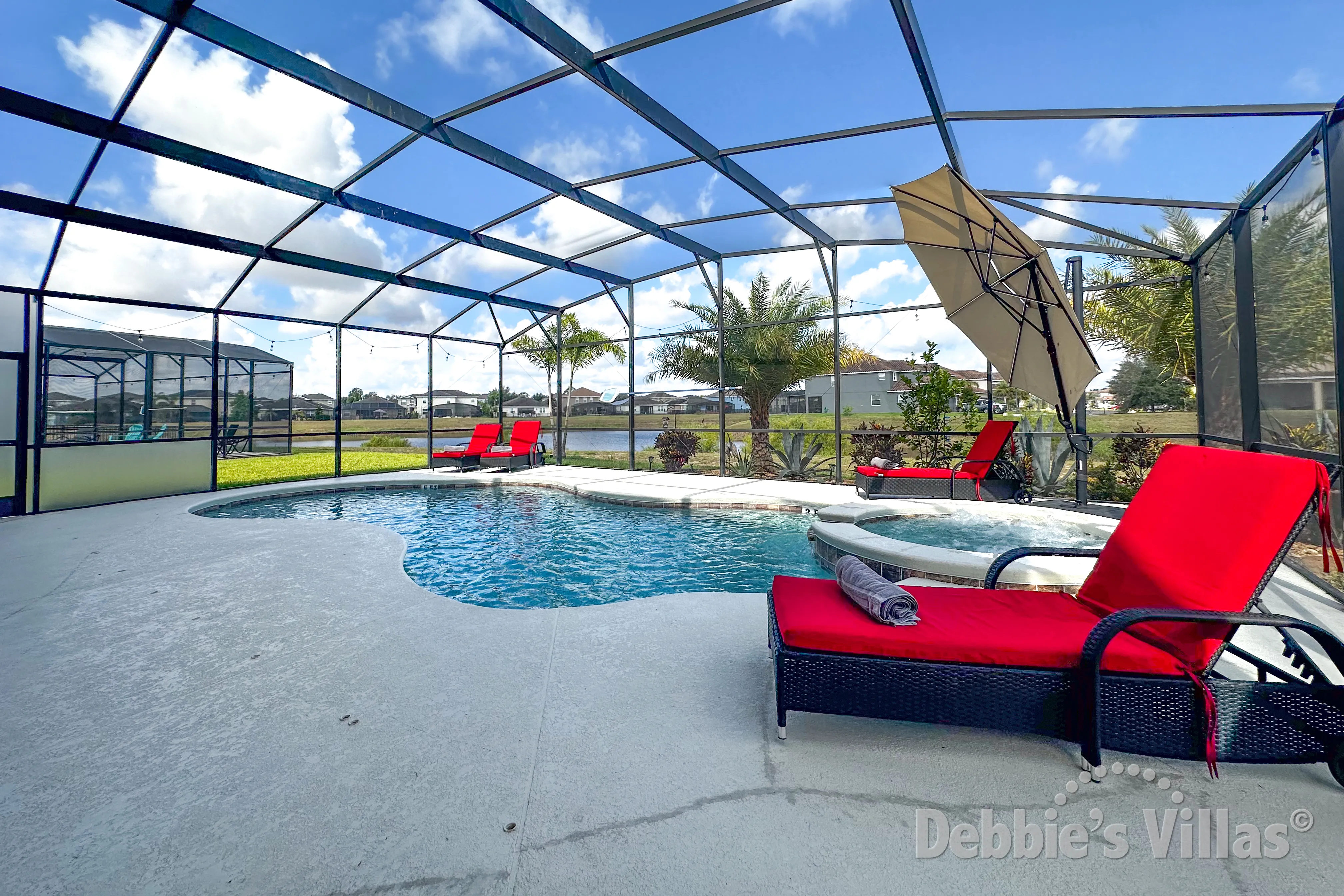 West-facing pool and spa at this vacation villa on Providence in Davenport