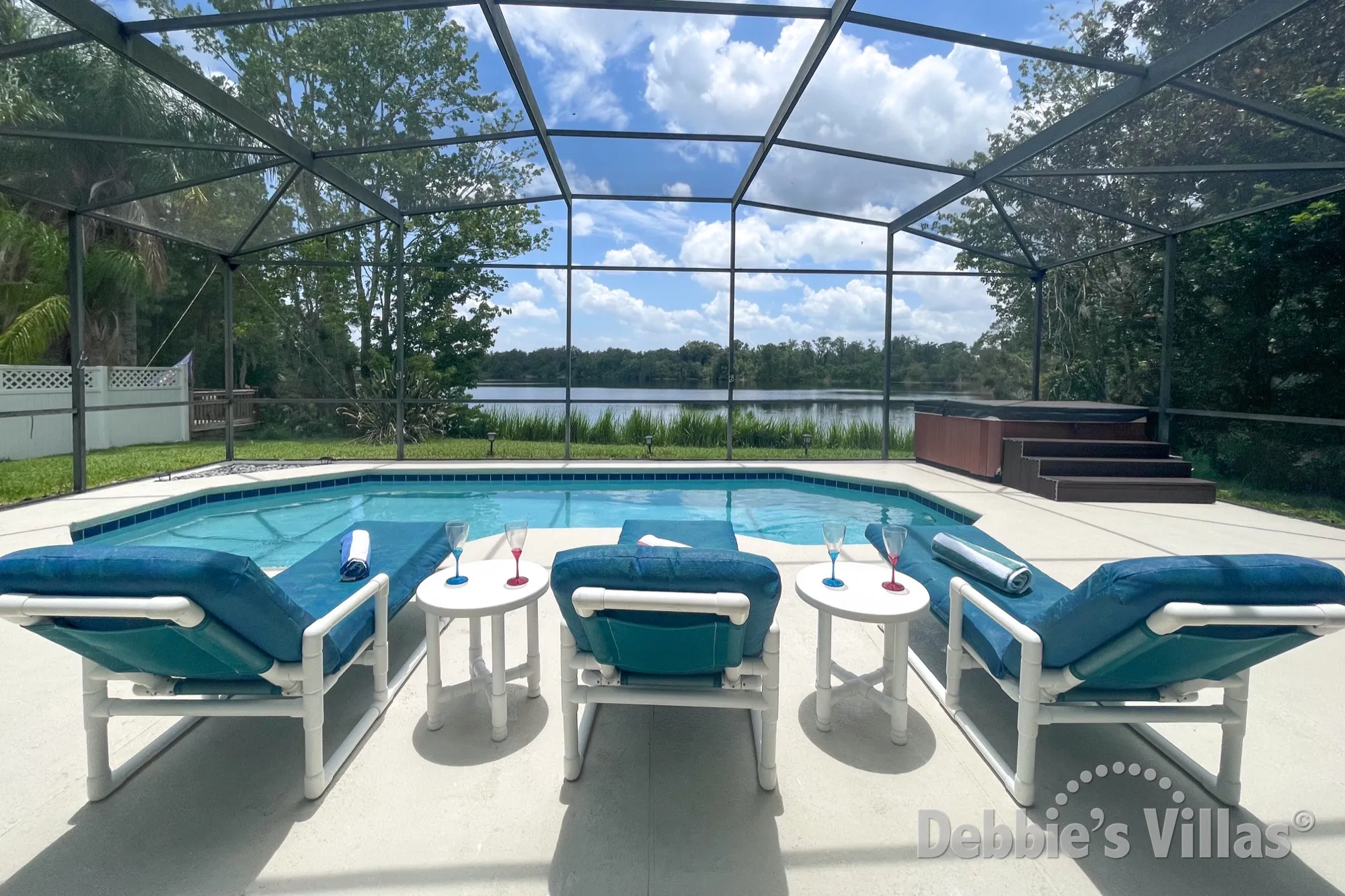Enjoy the lake view from the pool deck of this Kissimmee vacation villa