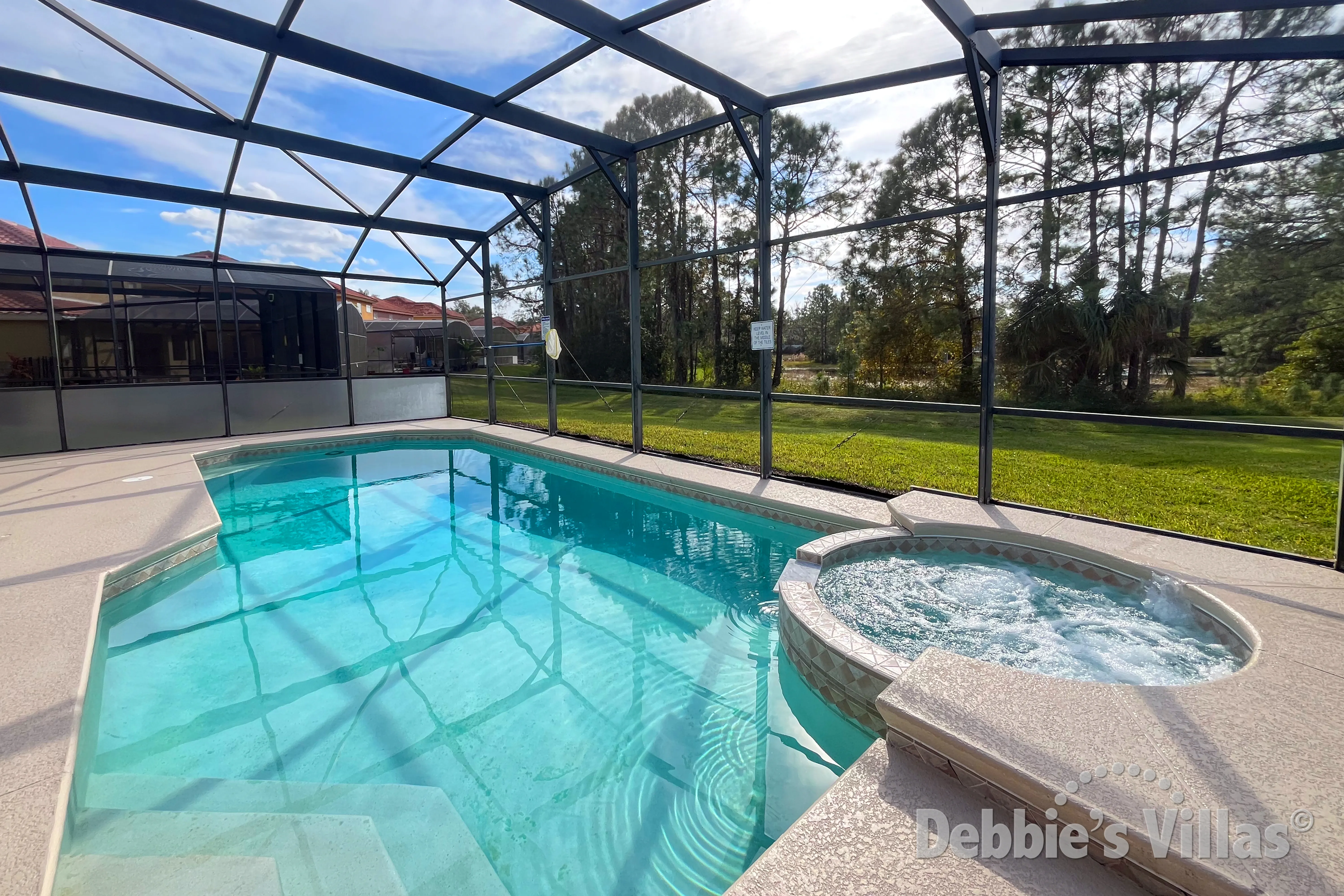 Southwest-facing pool and spa at this vacation villa on Watersong in Davenport