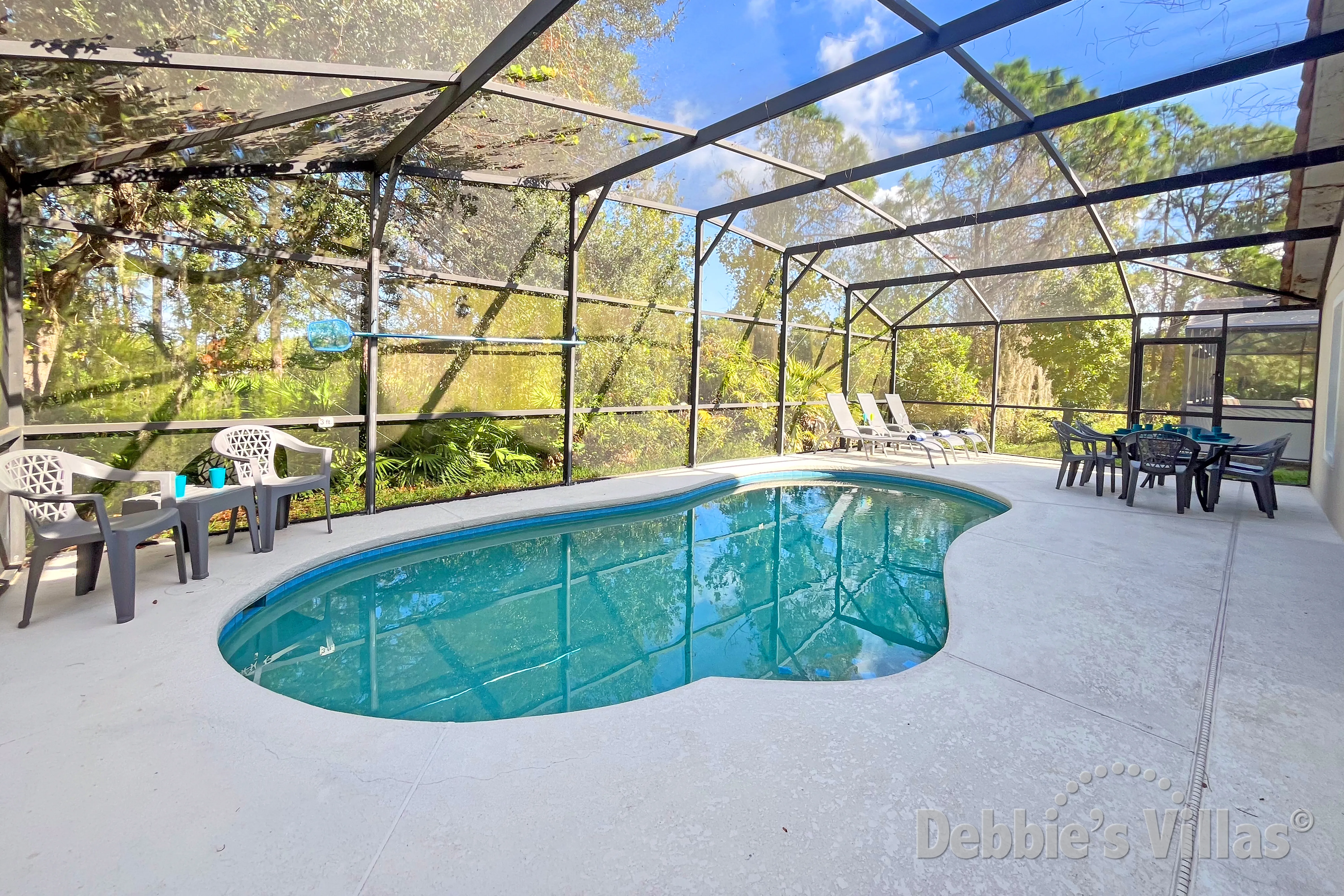 Private pool with conservation views at this vacation villa on Lake Wilson Reserve in Davenport 