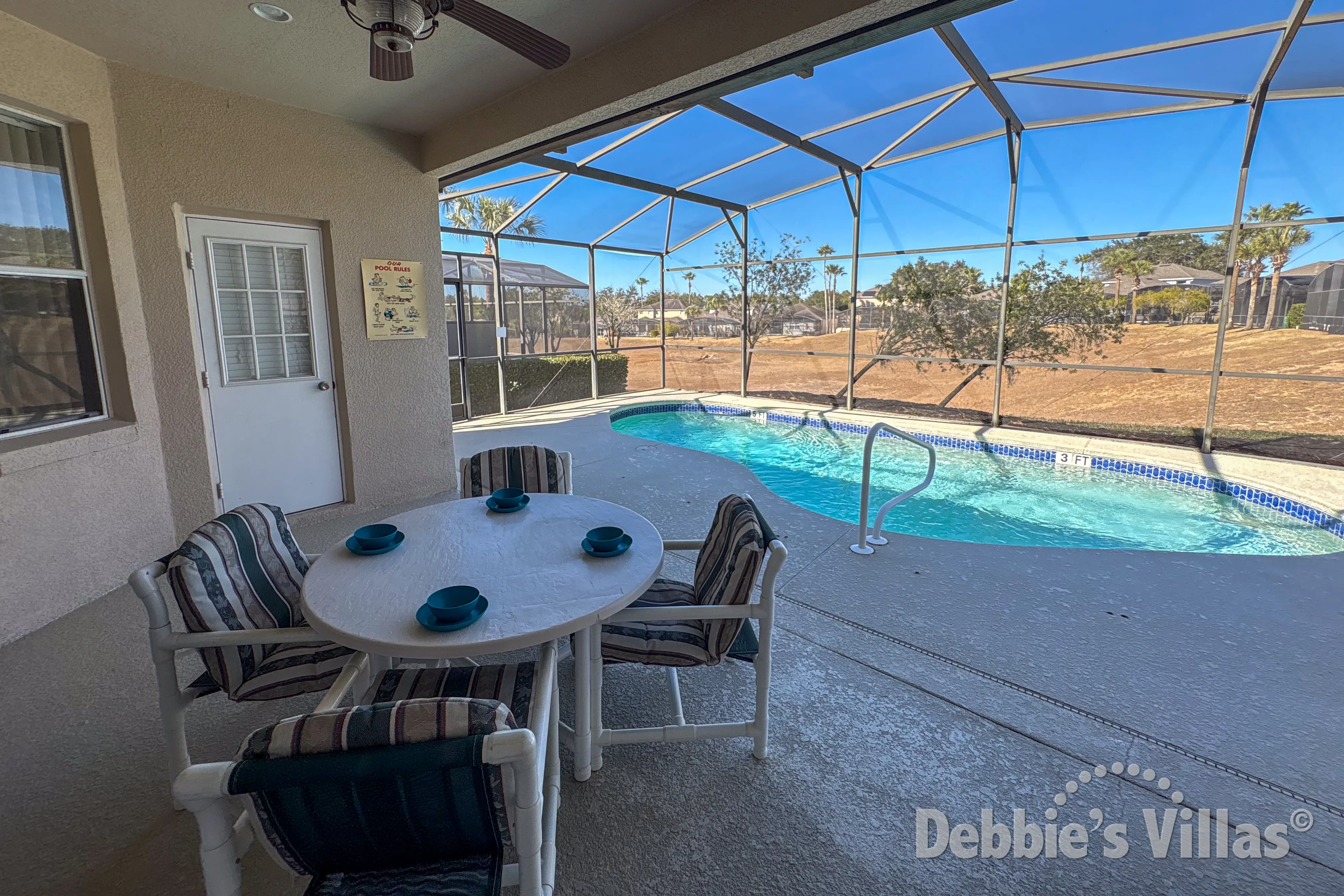 Covered dining table at the private pool at this vacation villa on Calabay Parc in Davenport 