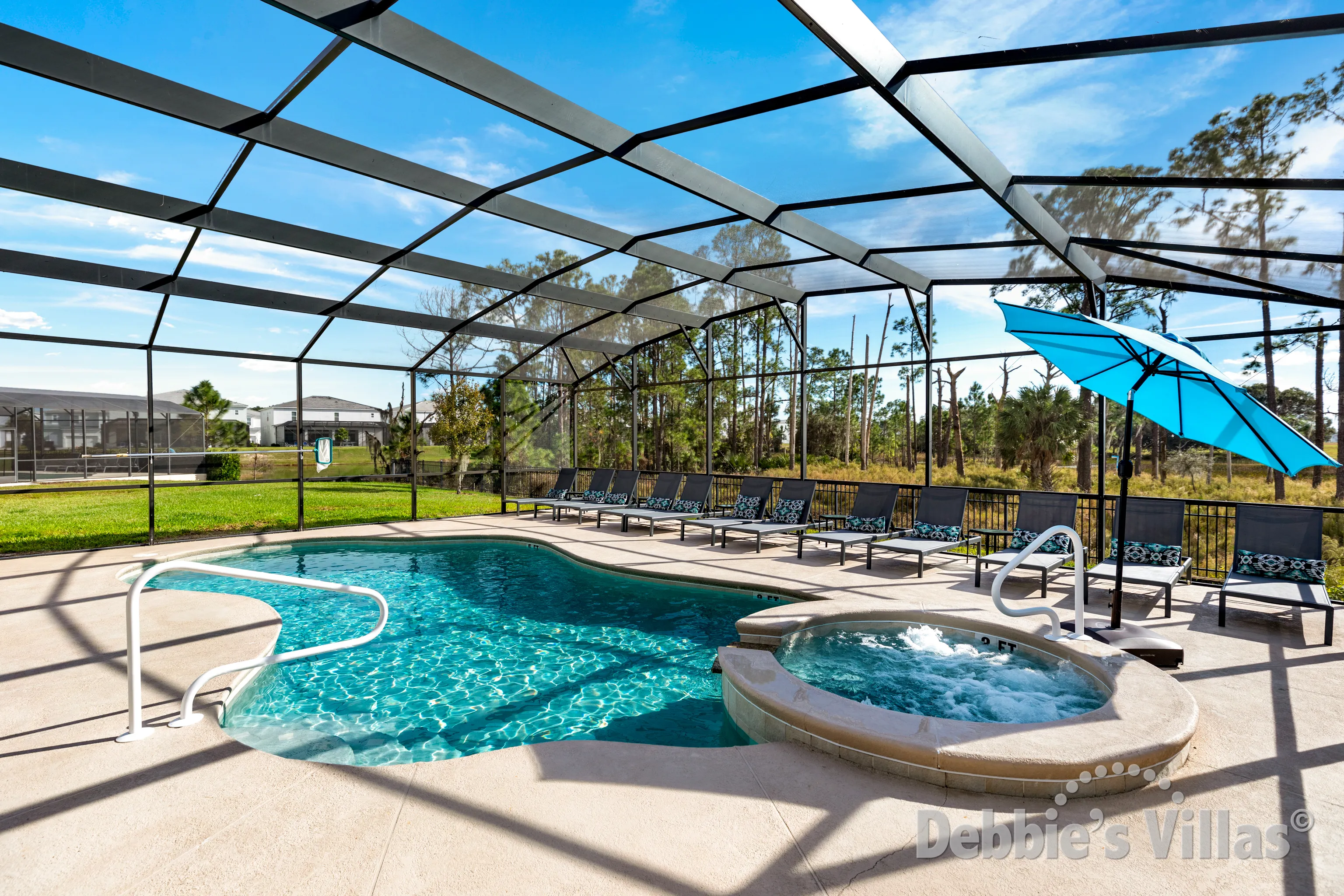 South-facing pool and spa at this vacation villa on Solterra in Davenport