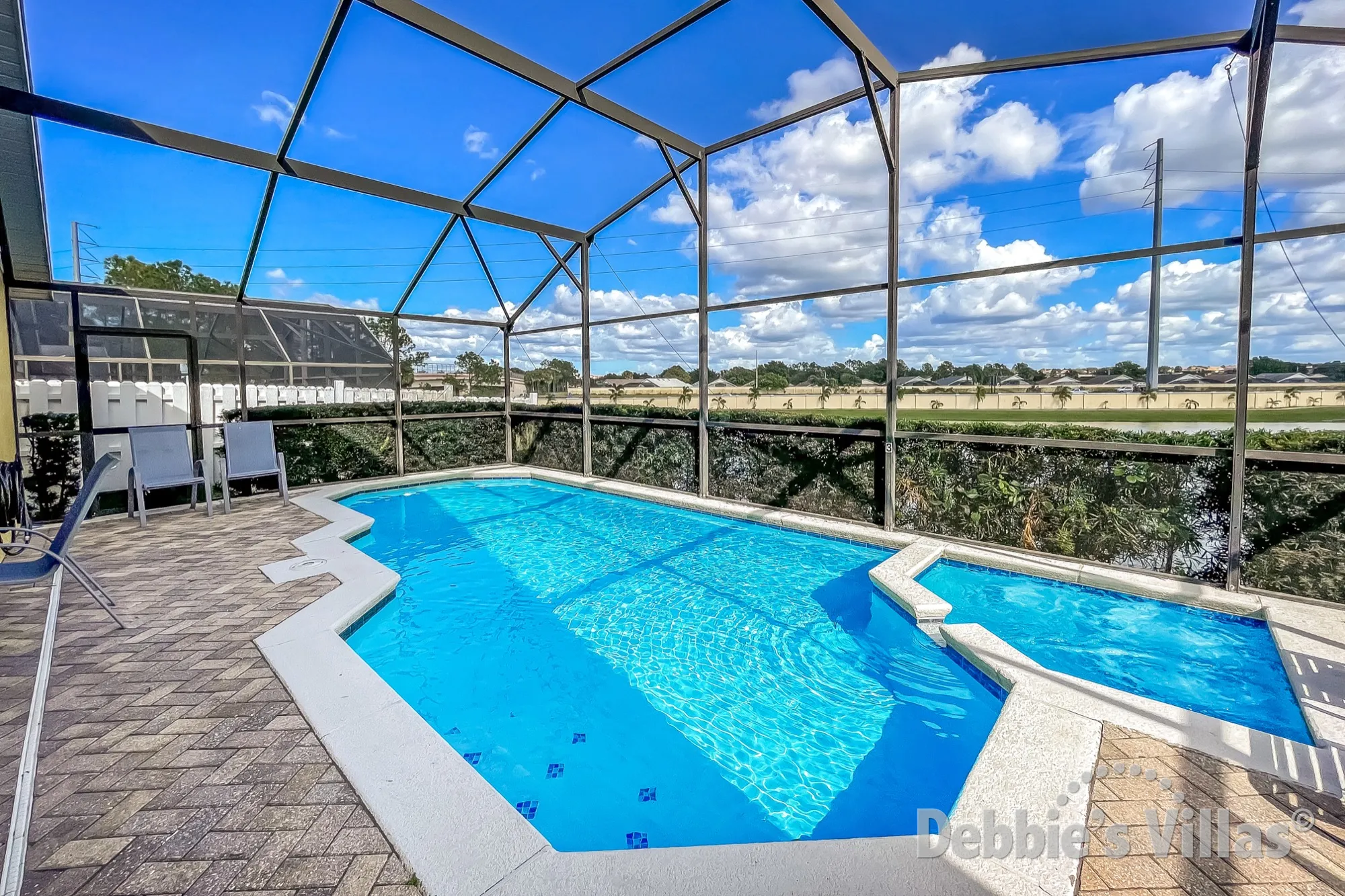 Kissimmee vacation villa with a lake view from the private pool and spa