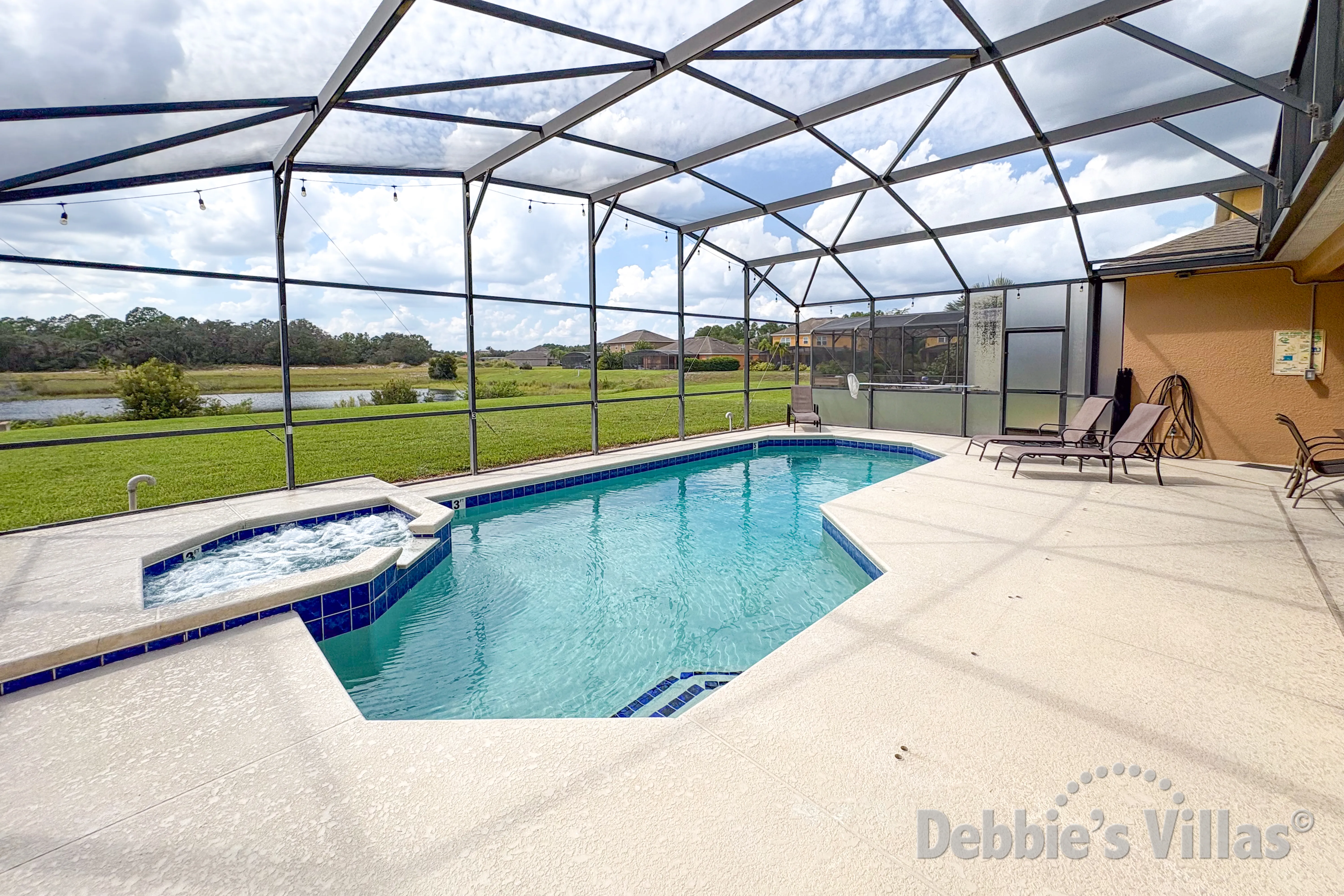 West-facing pool and spa at this vacation villa on Watersong in Davenport 