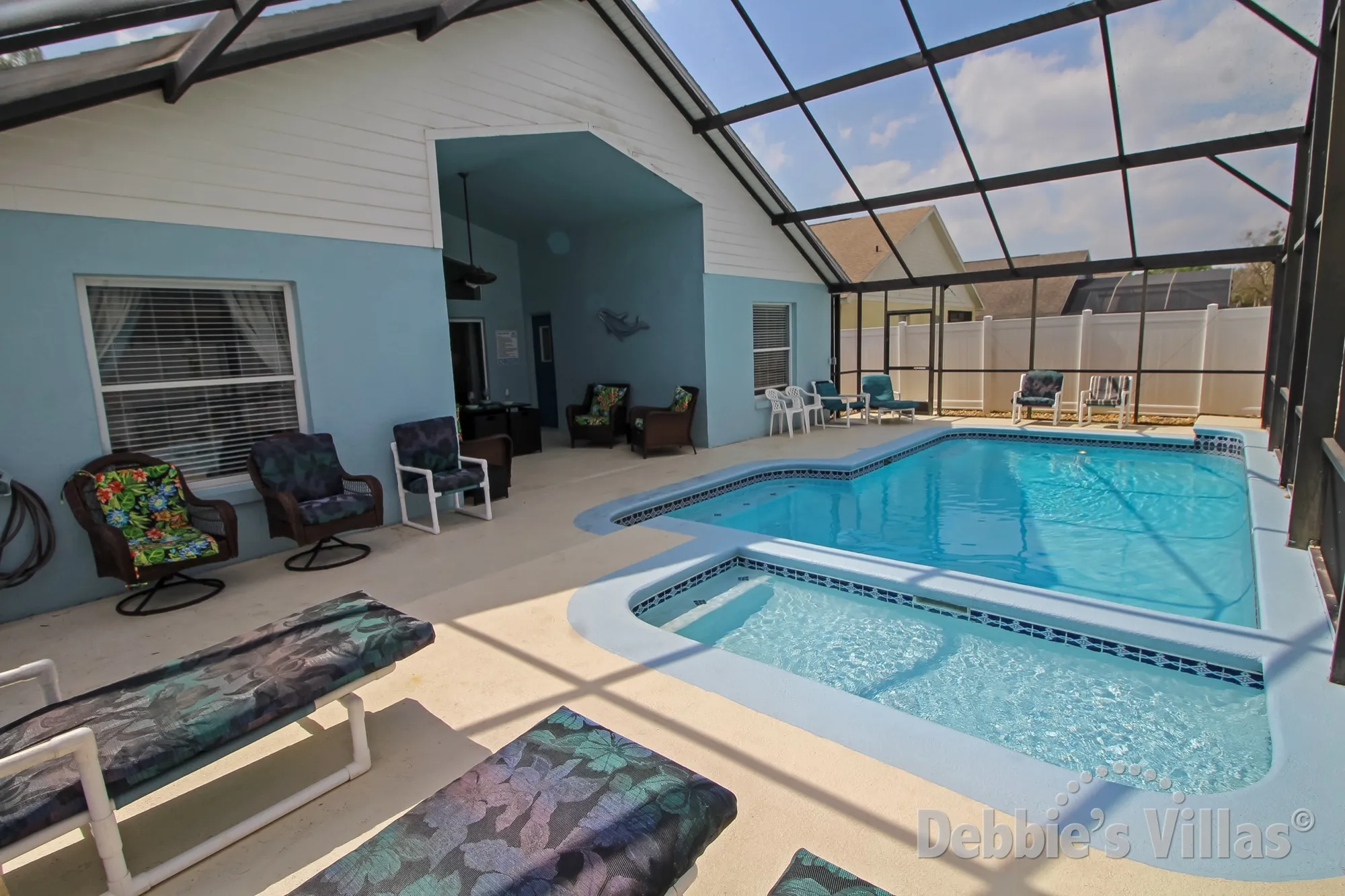 Plenty of seating options on the pool deck of this Kissimmee vacation villa