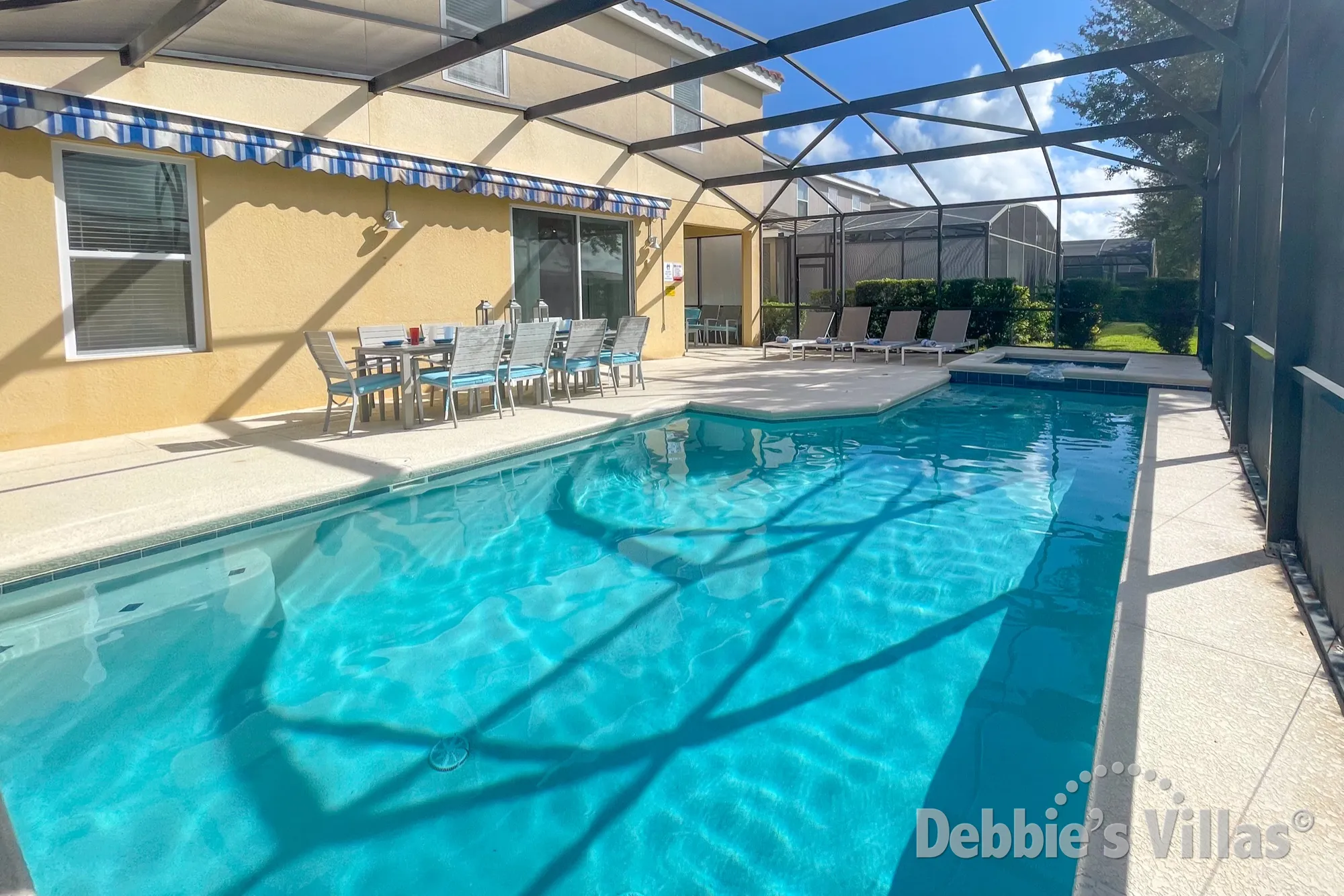 Seating for all the family to gather together on the pool deck of this Davenport vacation villa