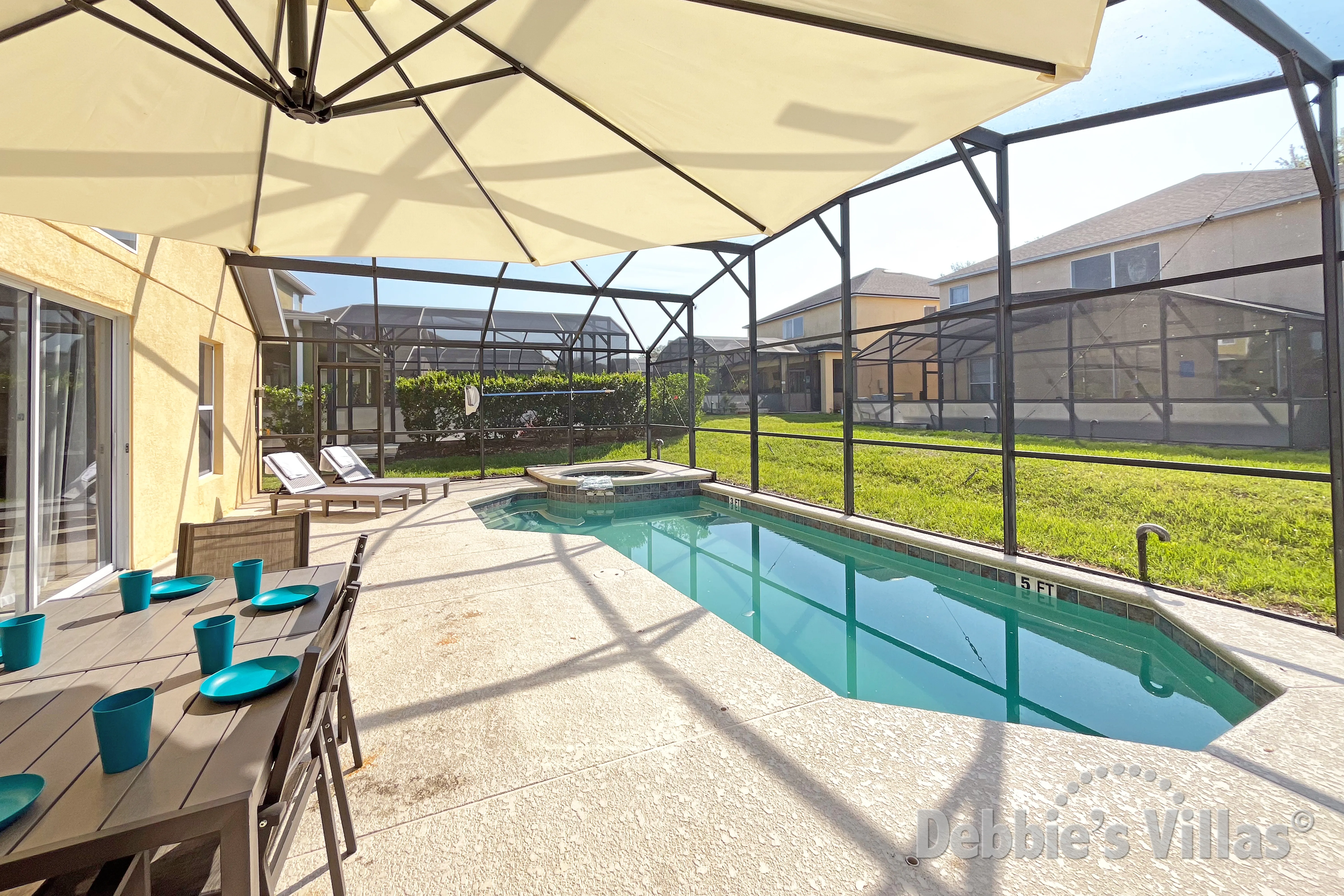 South-facing pool and spa at this vacation villa on Emerald Island in Kissimmee