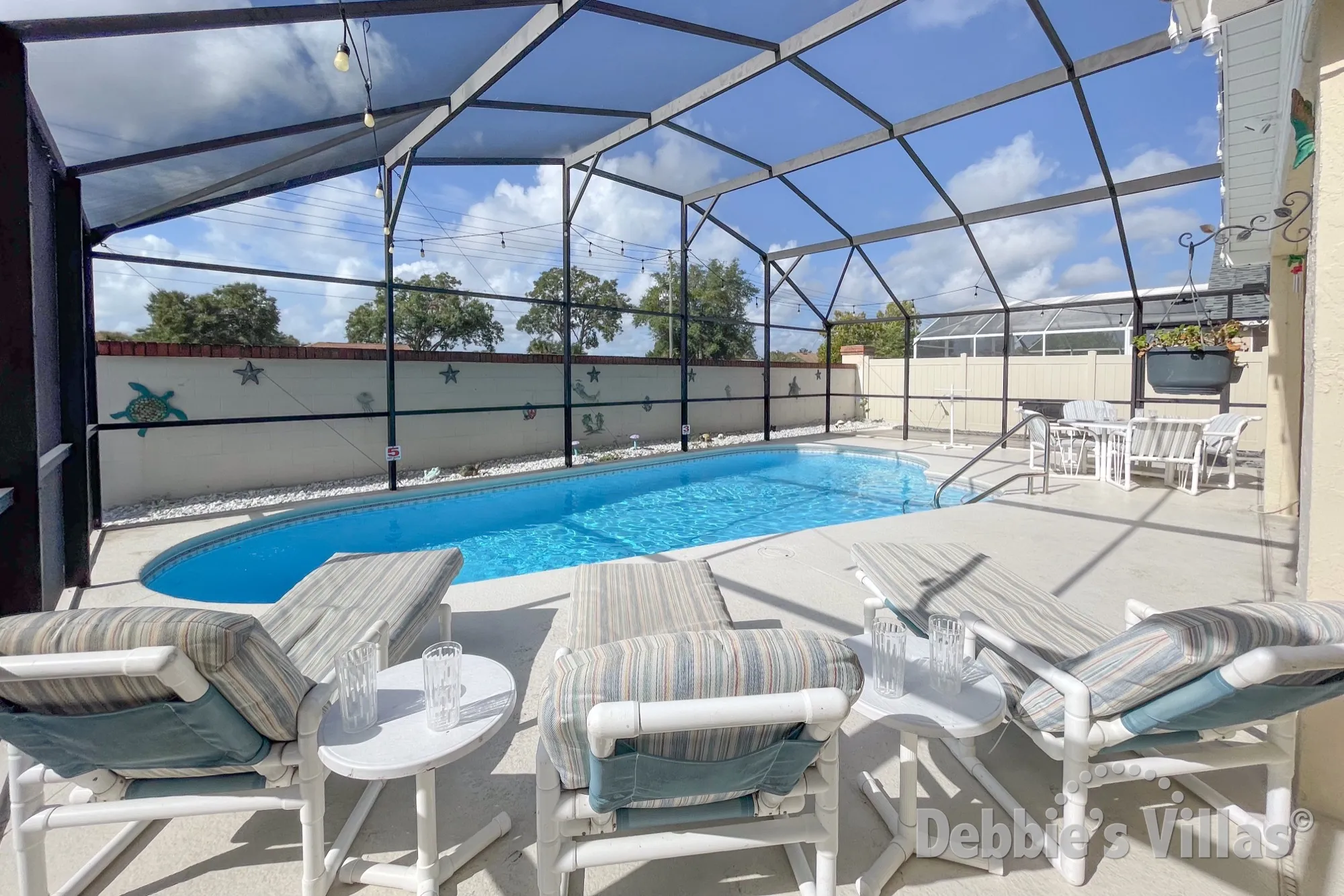 Sun-drenched south-facing pool deck at this Indian Ridge Oaks vacation villa