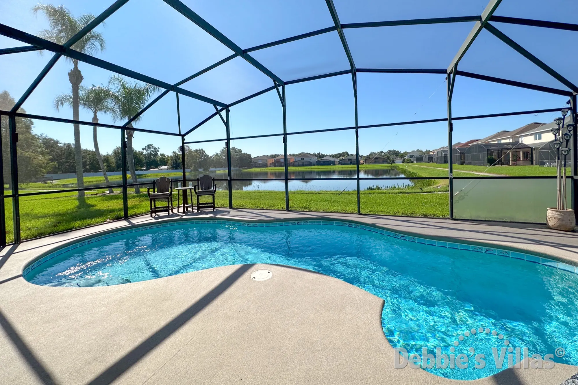 Stunning lake view from the south-facing pool deck of this Kissimmee vacation villa