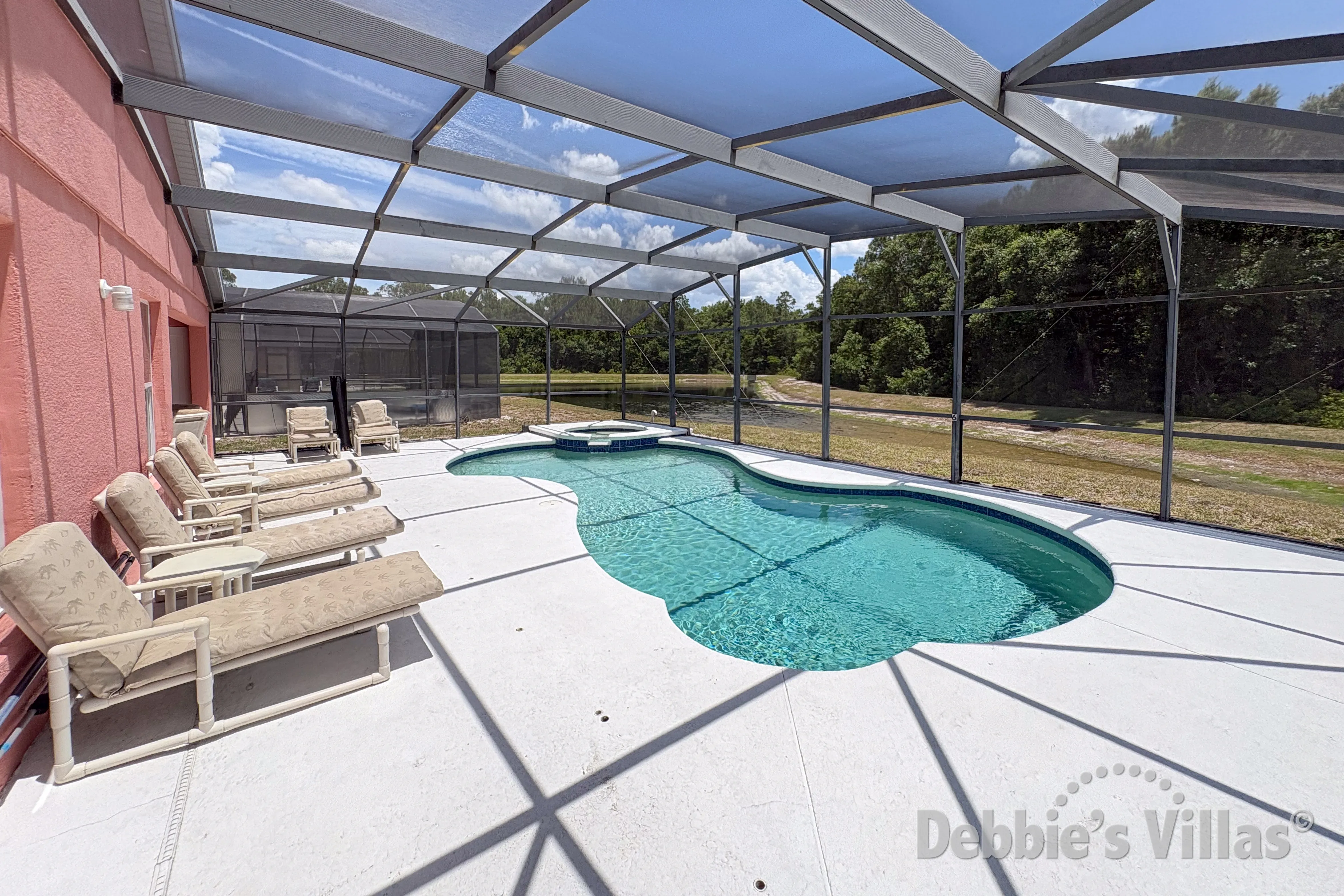 South-facing pool and spa at this vacation villa on Sandy Ridge in Davenport