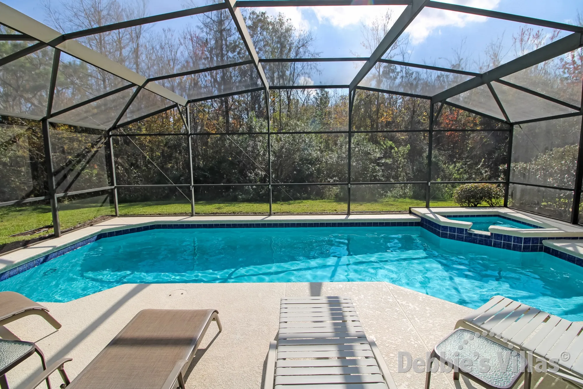 South-facing private pool and spa with woodland view at this Sandy Ridge villa in Davenport