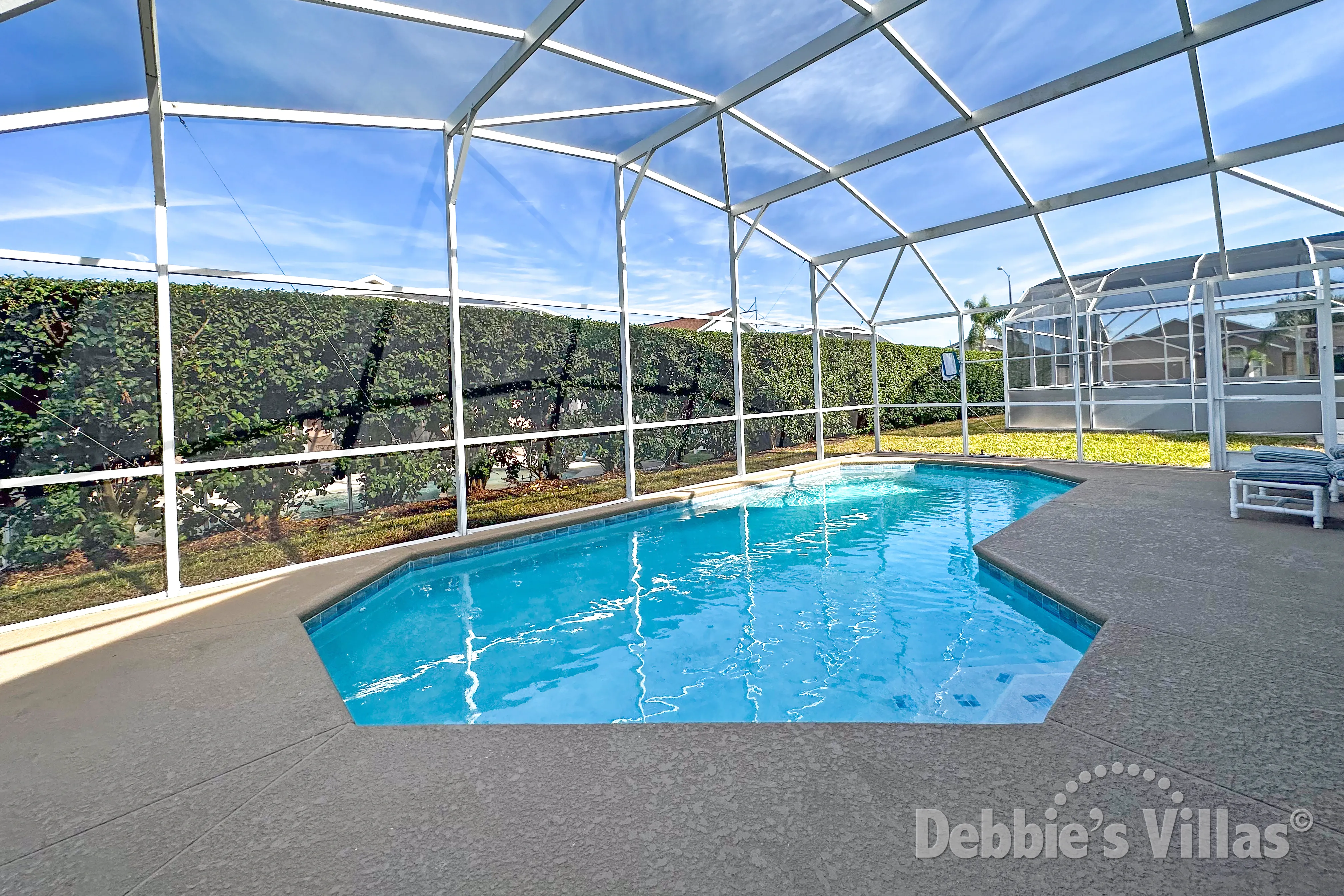 Relax on the pool deck with no overlooking neighbours at this Westbury vacation villa