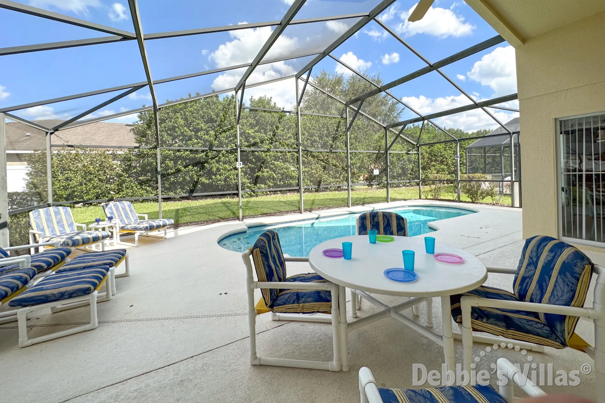 Everyone can enjoy snacks and drinks on the pool deck of this West Haven vacation villa