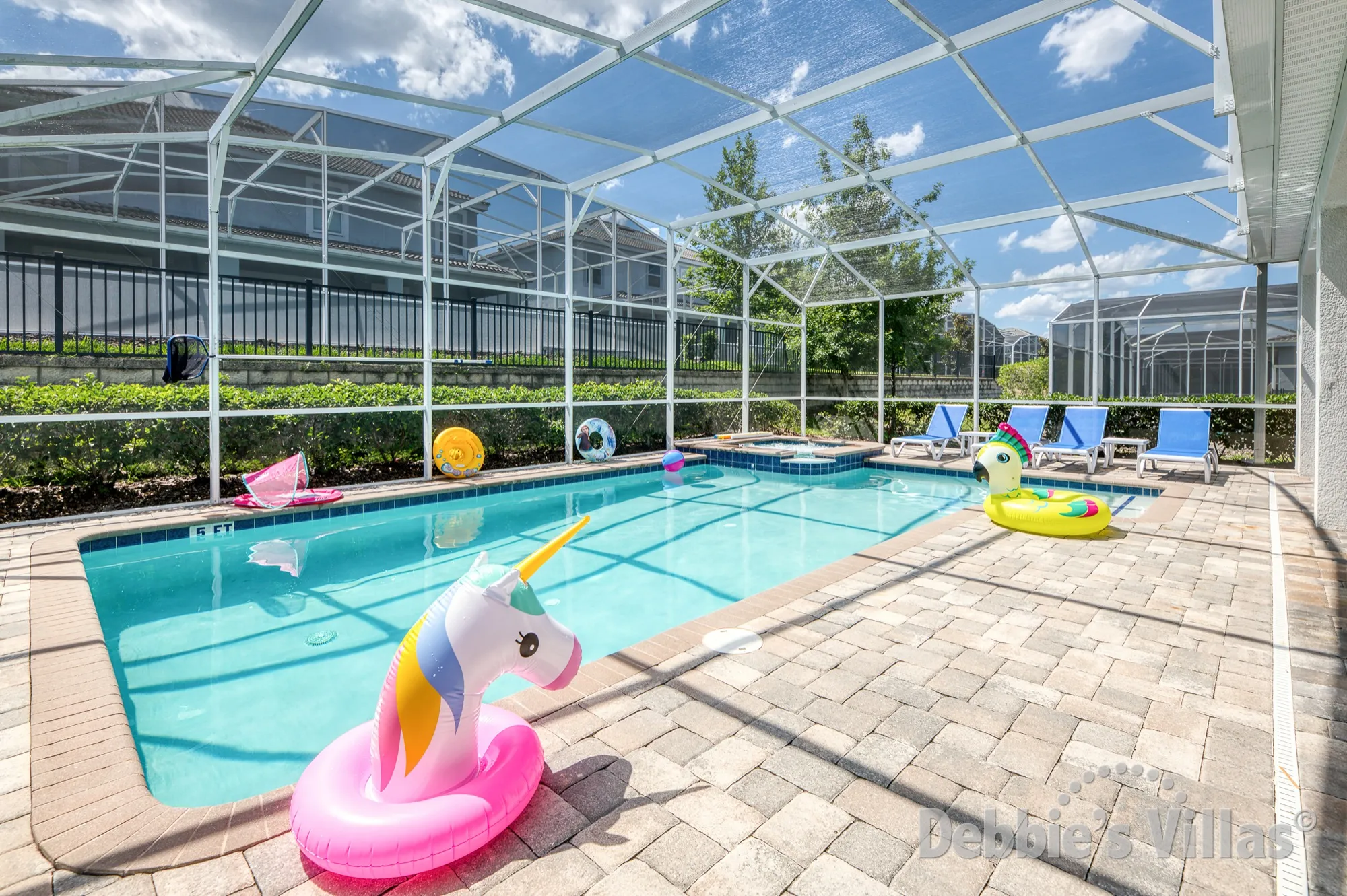 Sun-drenched west-facing pool and spa deck at this Davenport vacation villa