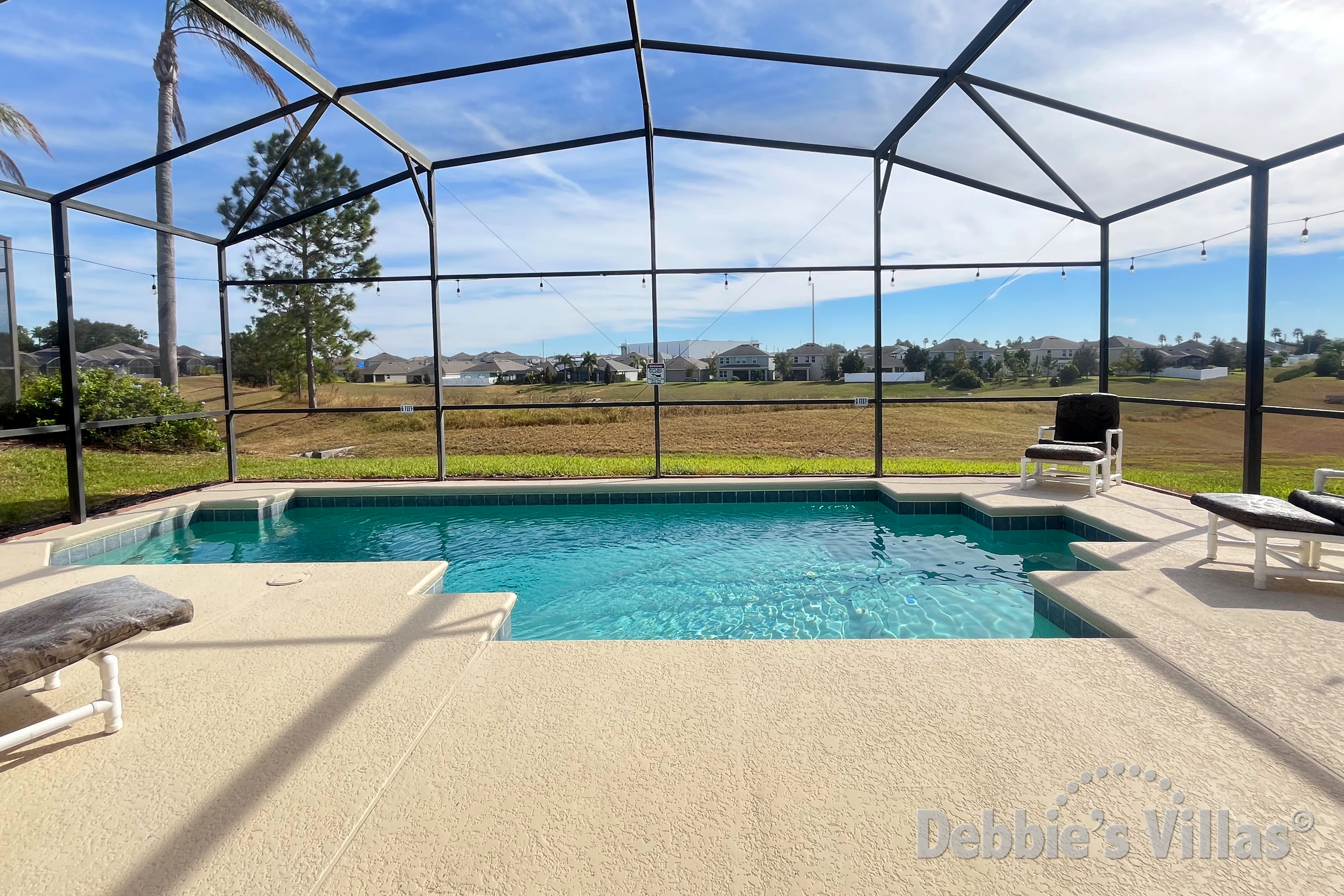 Private southeast-facing pool deck at this vacation villa on Calabay Parc in Davenport