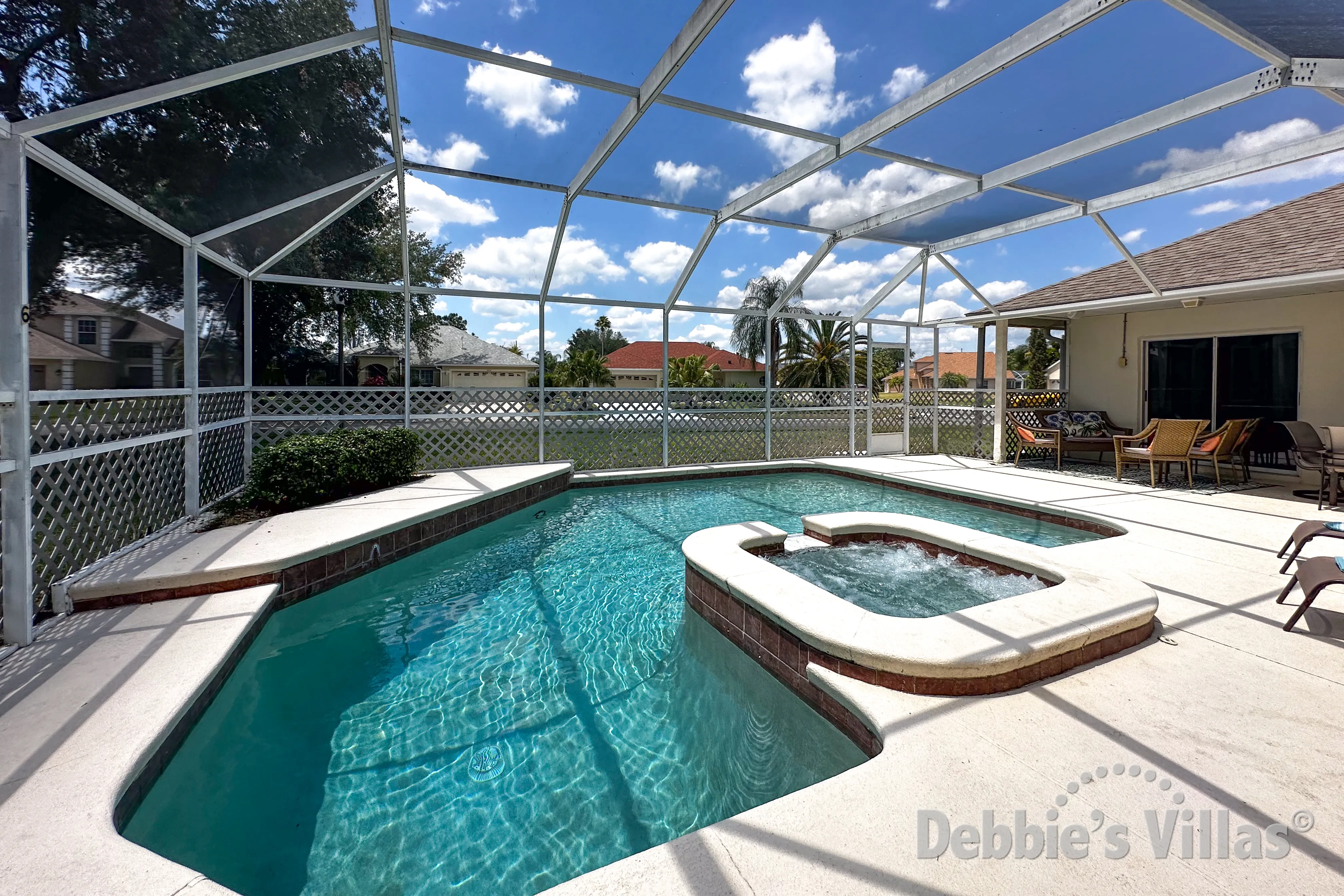Southwest-facing pool and spa at this vacation villa on Oak Islands Cove in Kissimmee