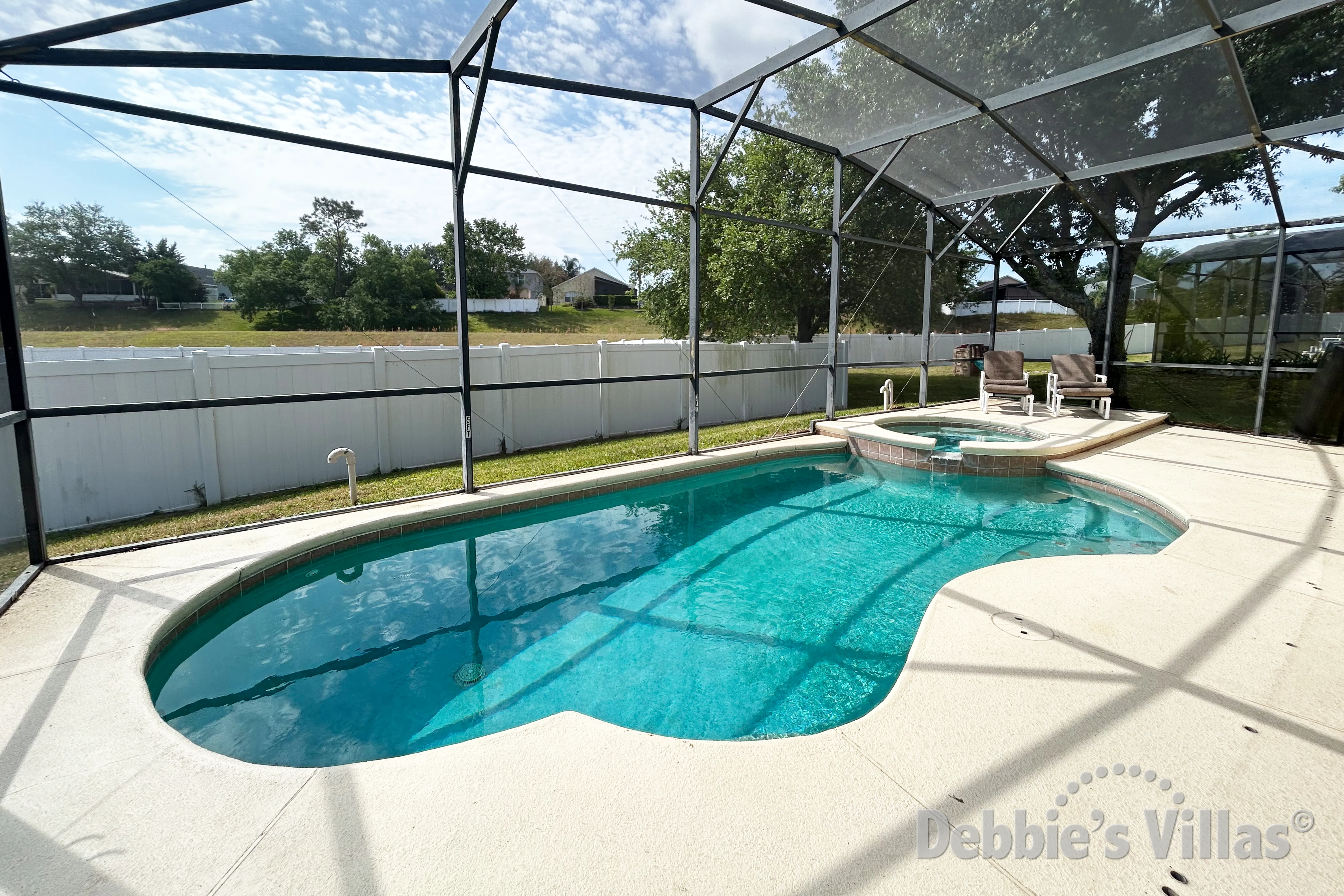 South-facing pool and spa at this vacation villa on Mission Park in Clermont 