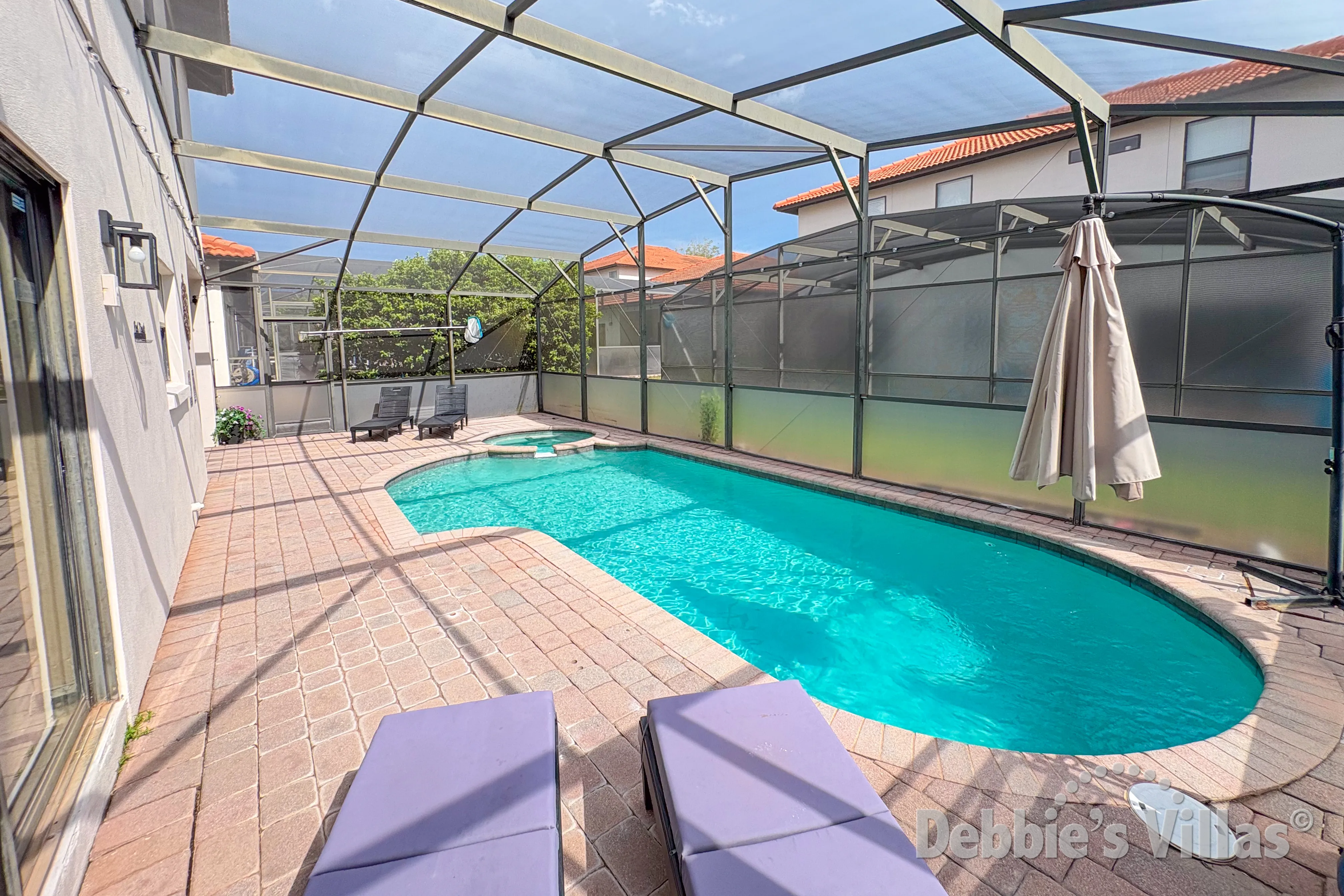 South-facing pool and spa at this vacation villa on High Grove in Clermont