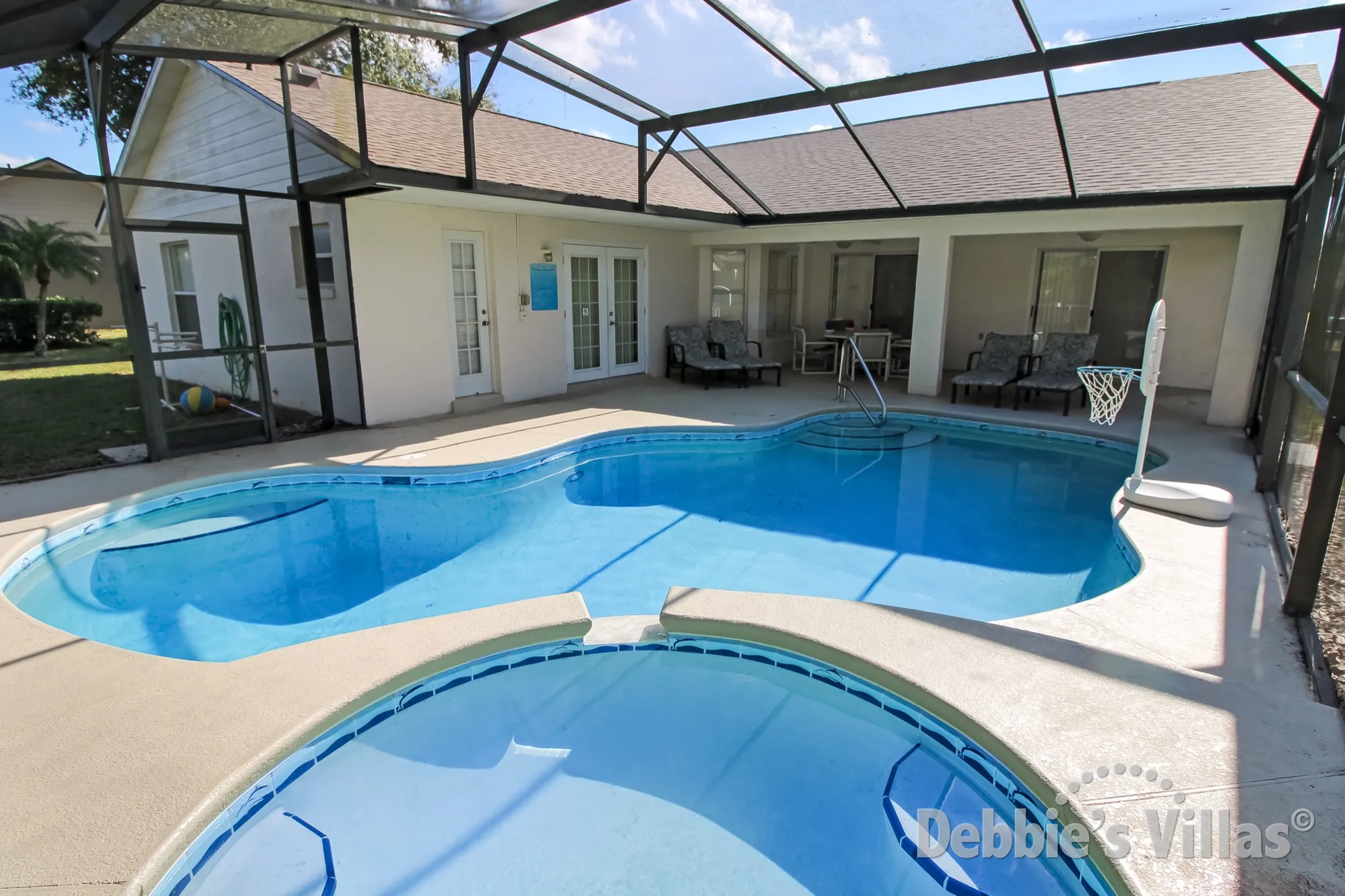 West-facing pool and spa at this villa in Greater Groves