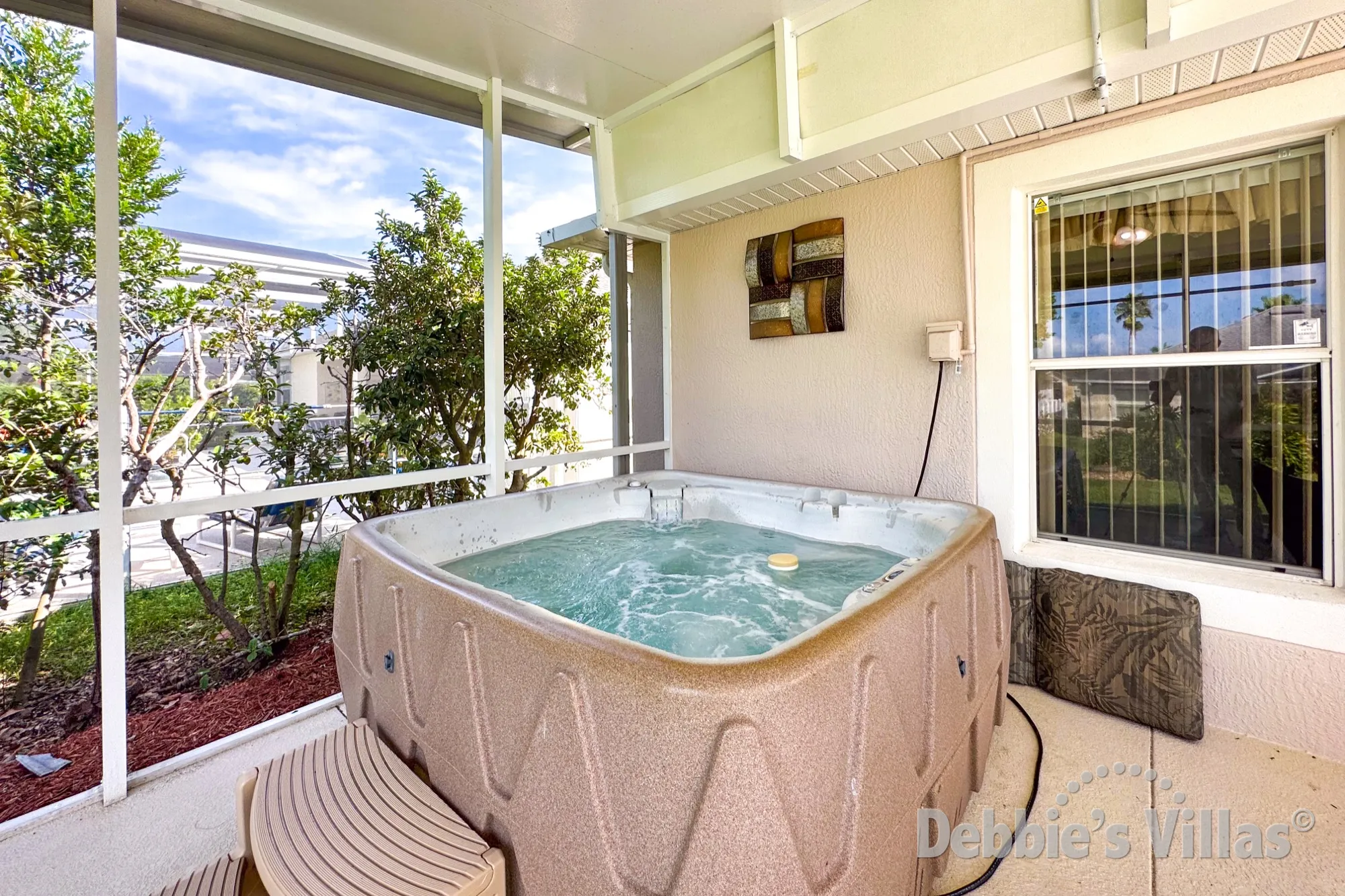 Relax with a drink in the spa at this Davenport vacation villa
