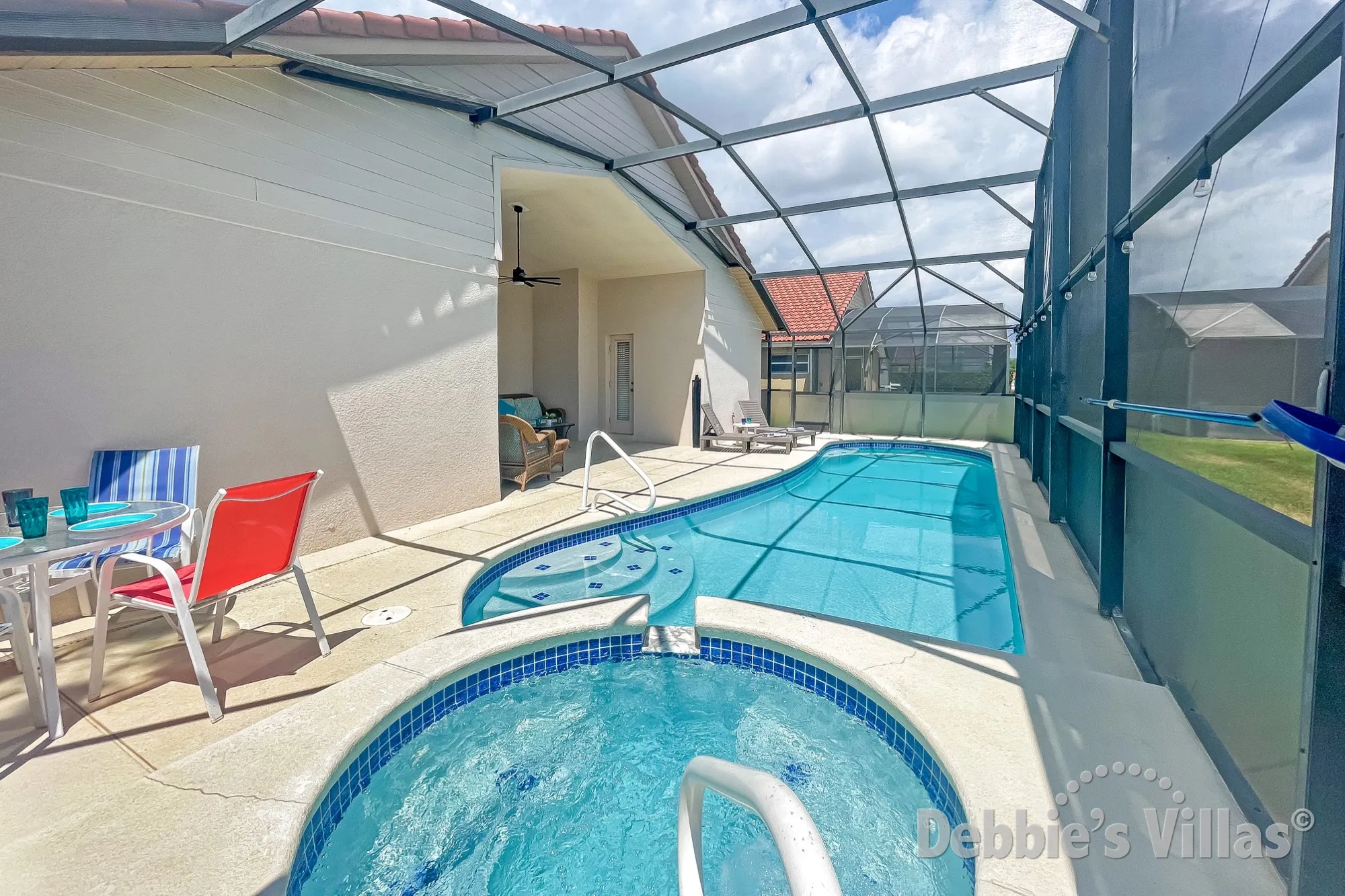Easy access steps and handrail into the pool and spa at this Davenport vacation villa