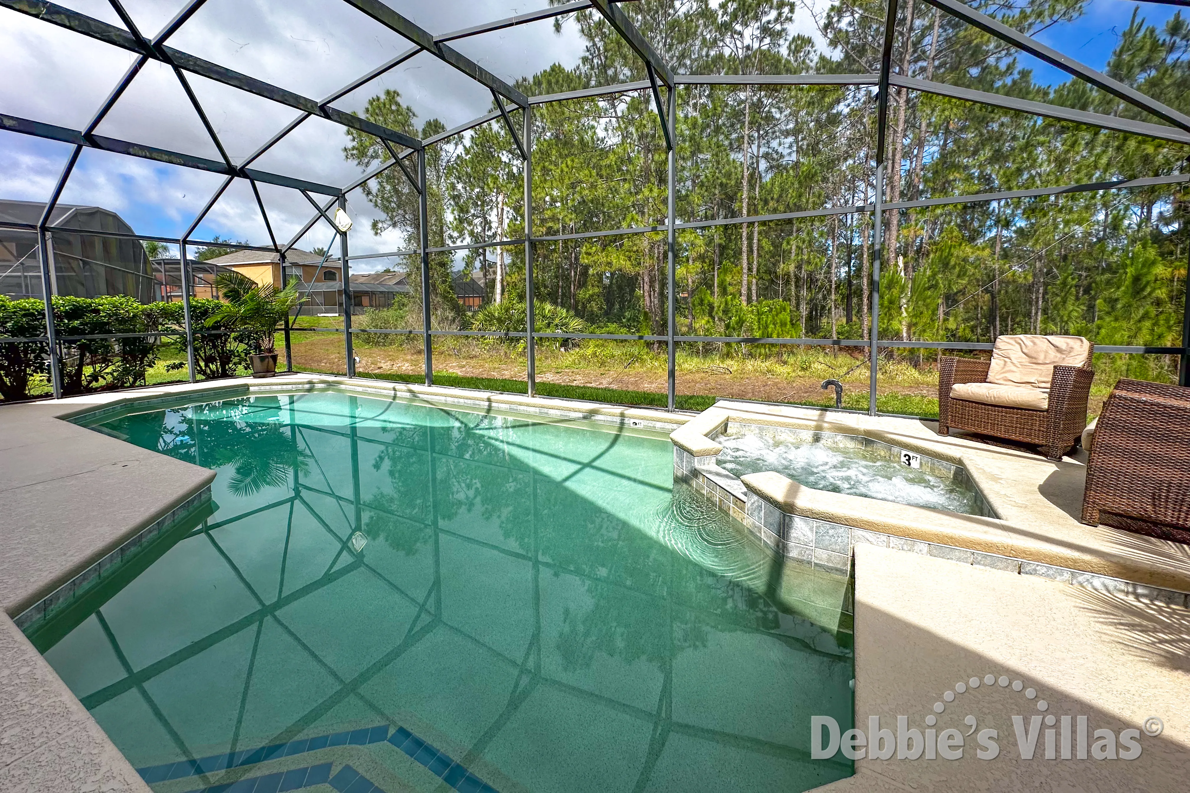 West-facing pool and spa at this vacation villa on Watersong in Davenport