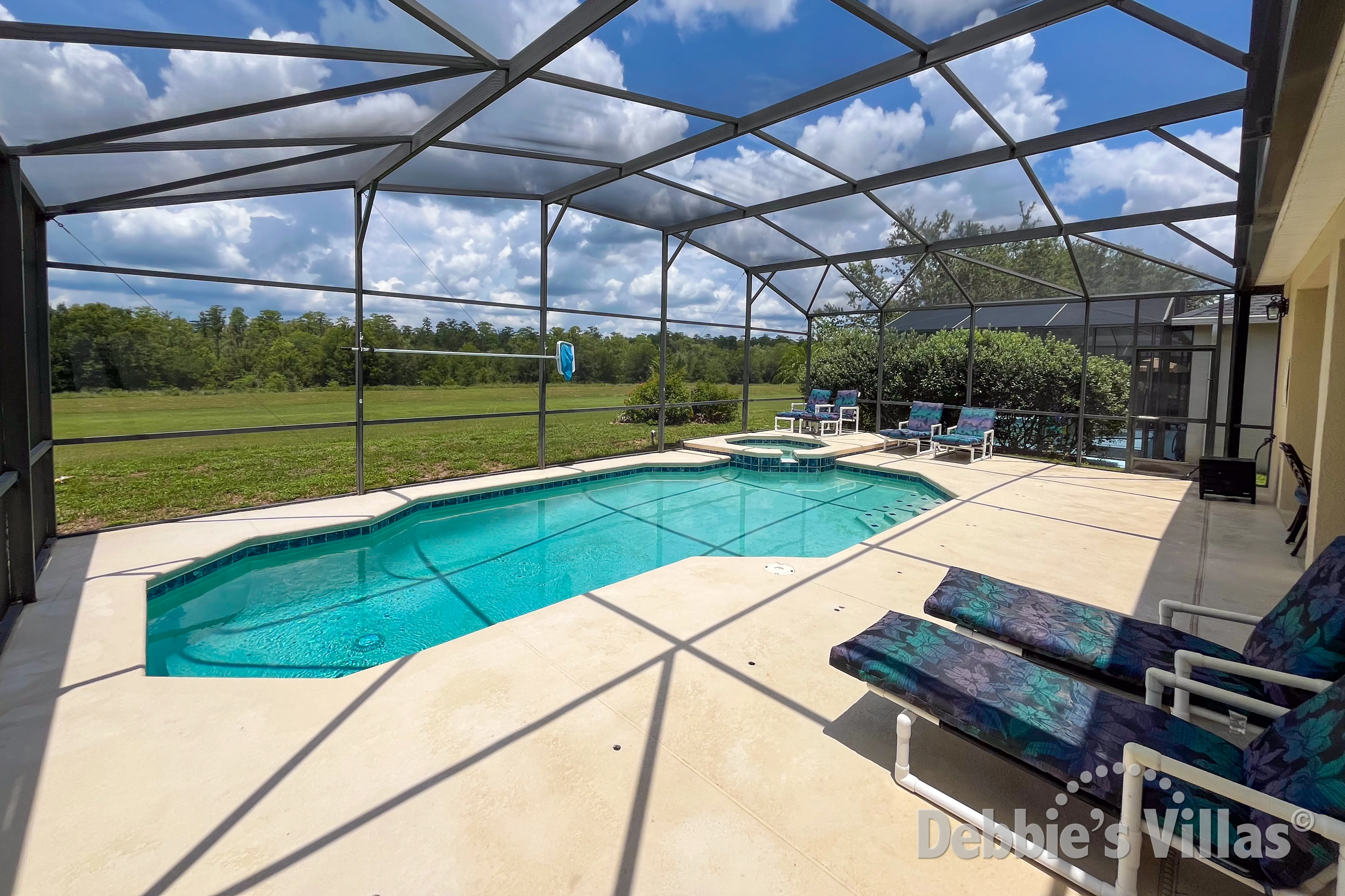 West-facing pool and spa at this vacation villa on The Retreat at Legacy Park in Davenport 