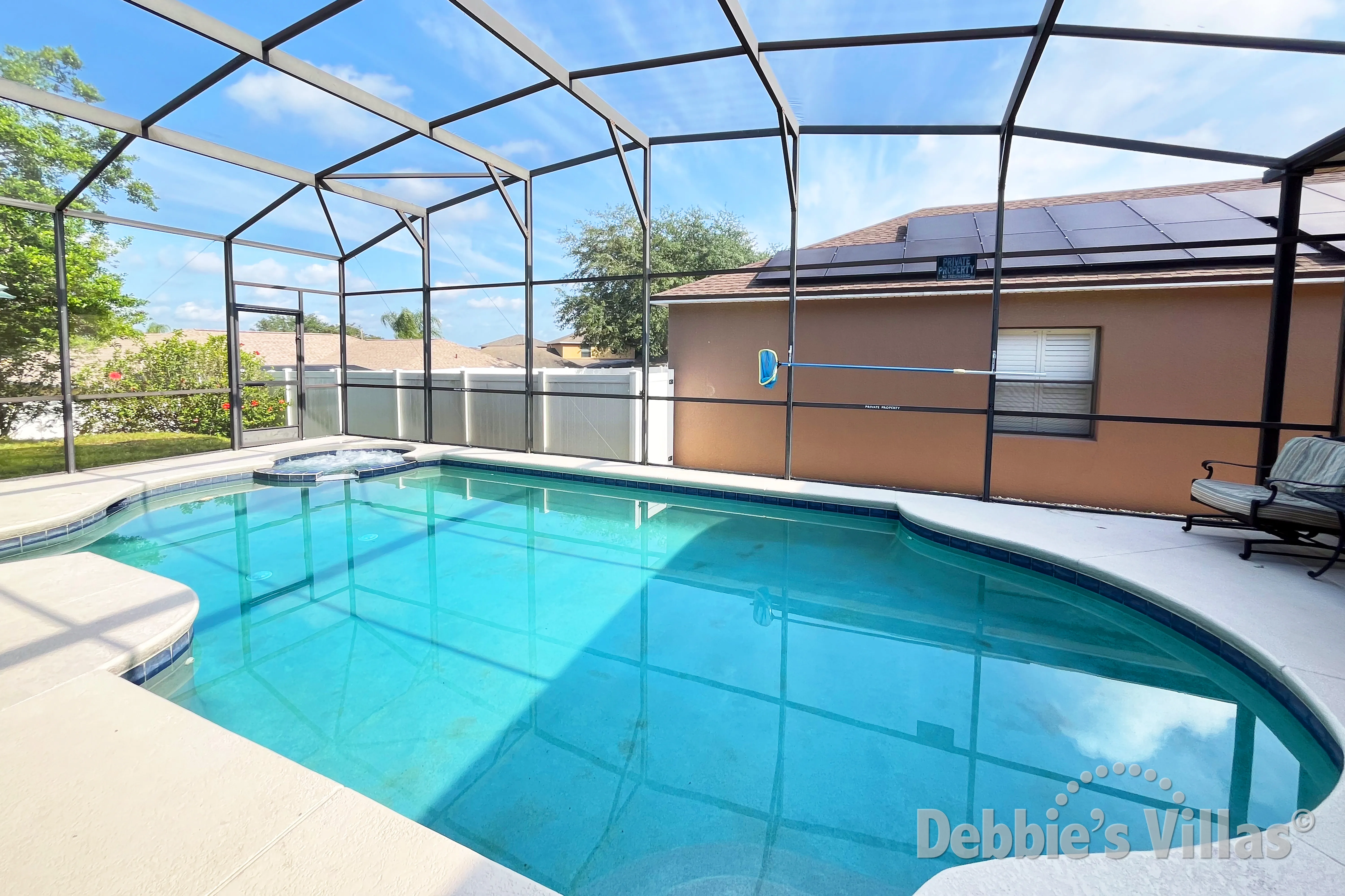 West-facing pool and spa at this vacation villa on The Estates at Legacy Park in Davenport